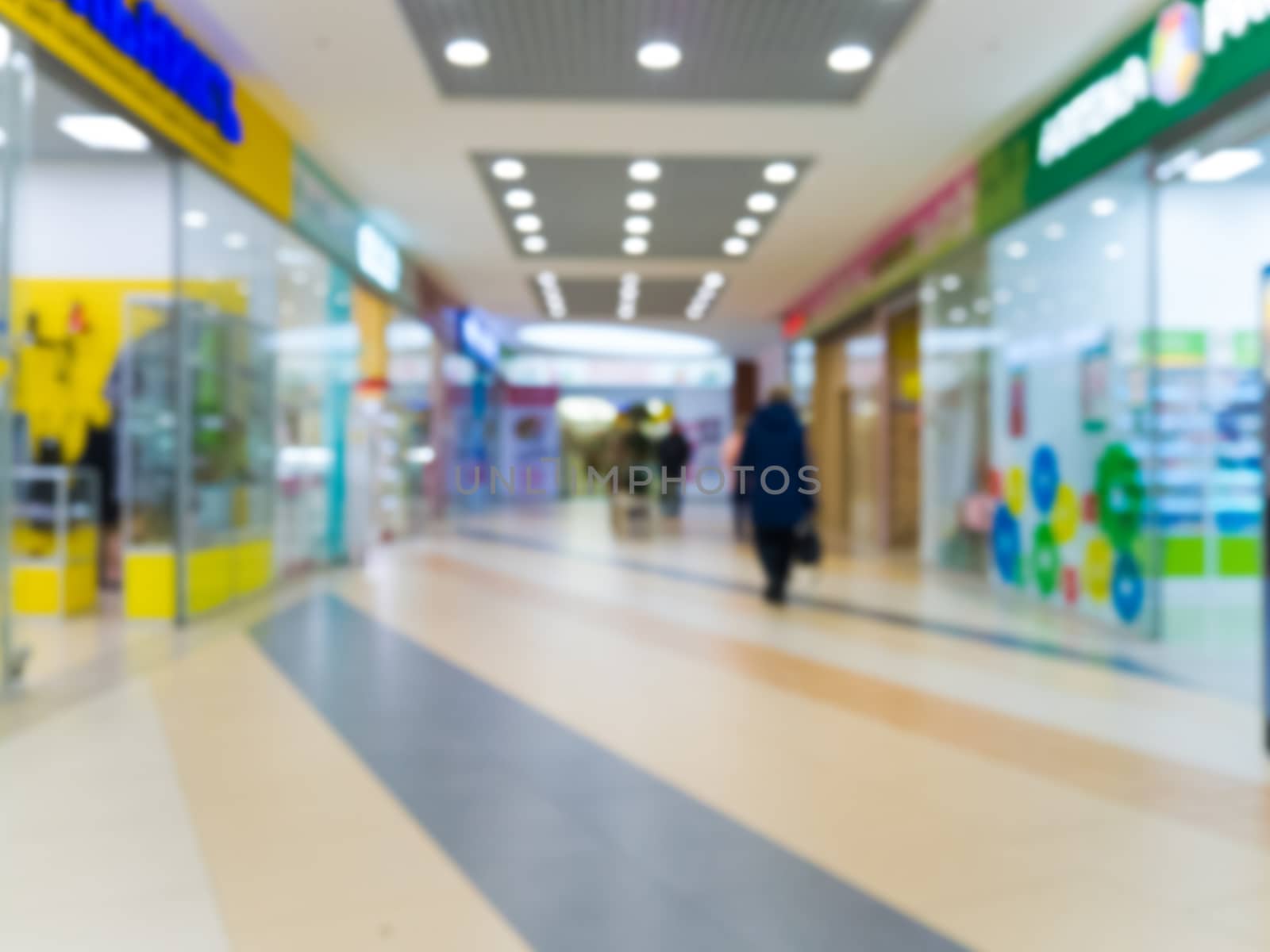 Shopping mall blur background with bokeh. Blurred hall of shopping mall as background.