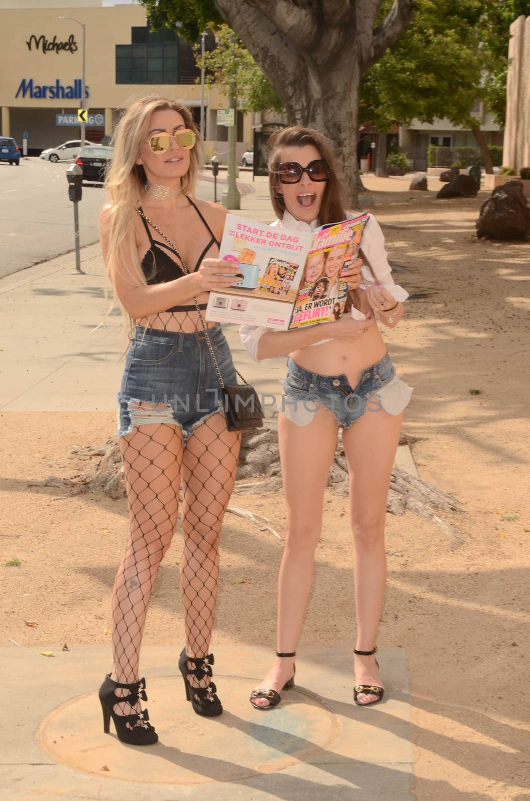 Ana Braga, Alicia Arden the "Baywatch" actress and the Brazilian Playmate caught hanging out together and proudly showing off a Belgian magazine that has both their photos in it, Studio City, CA 05-08-17