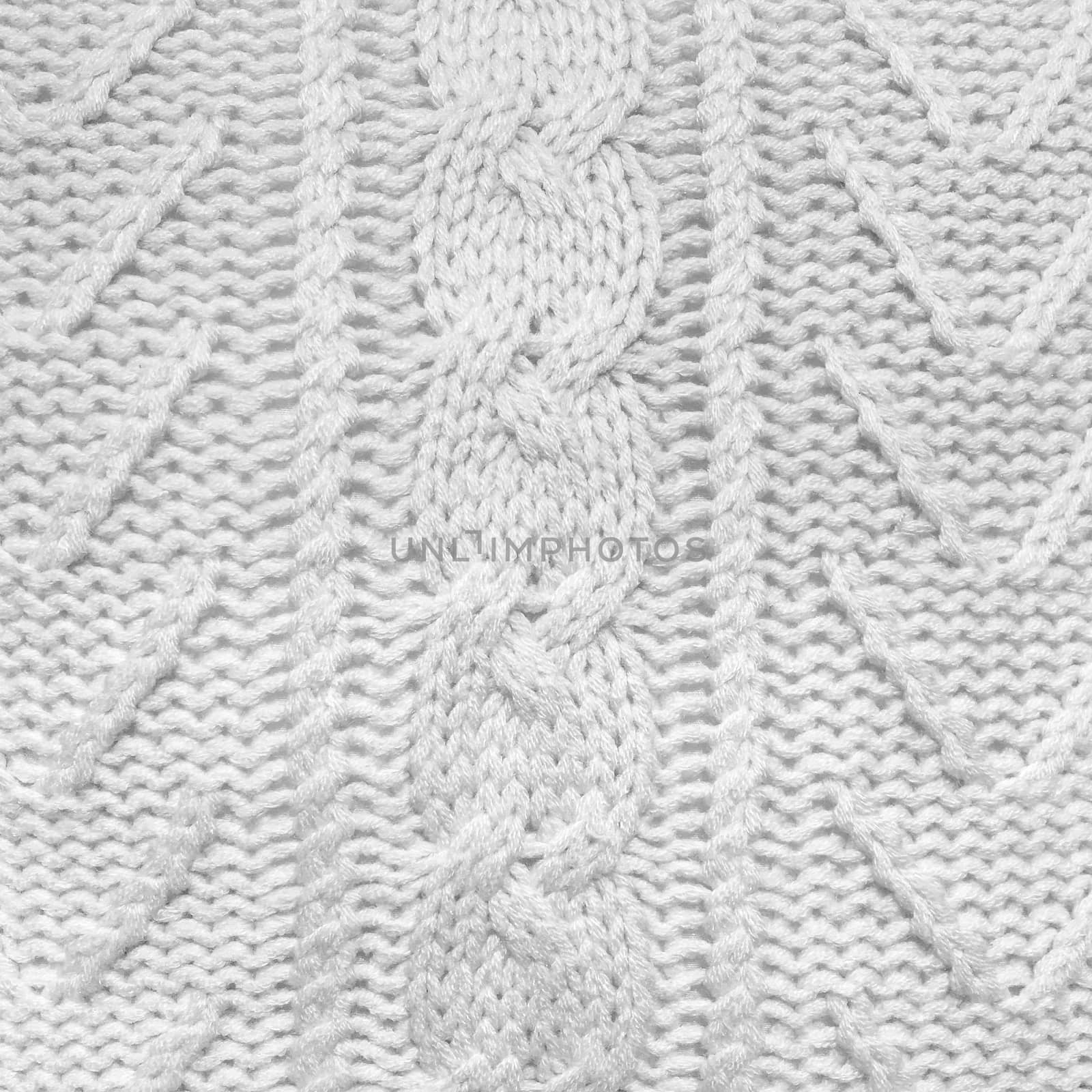 White of knitted background with simple ornament.