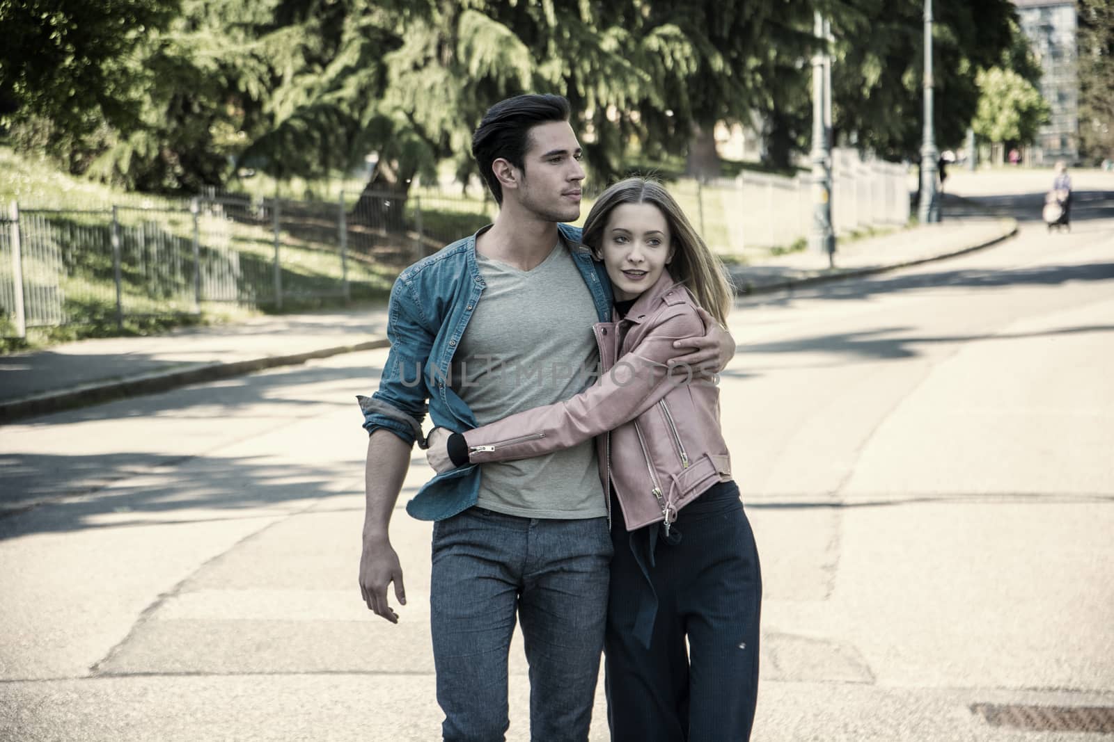 Attractive romantic couple, young man and girl standing by artofphoto