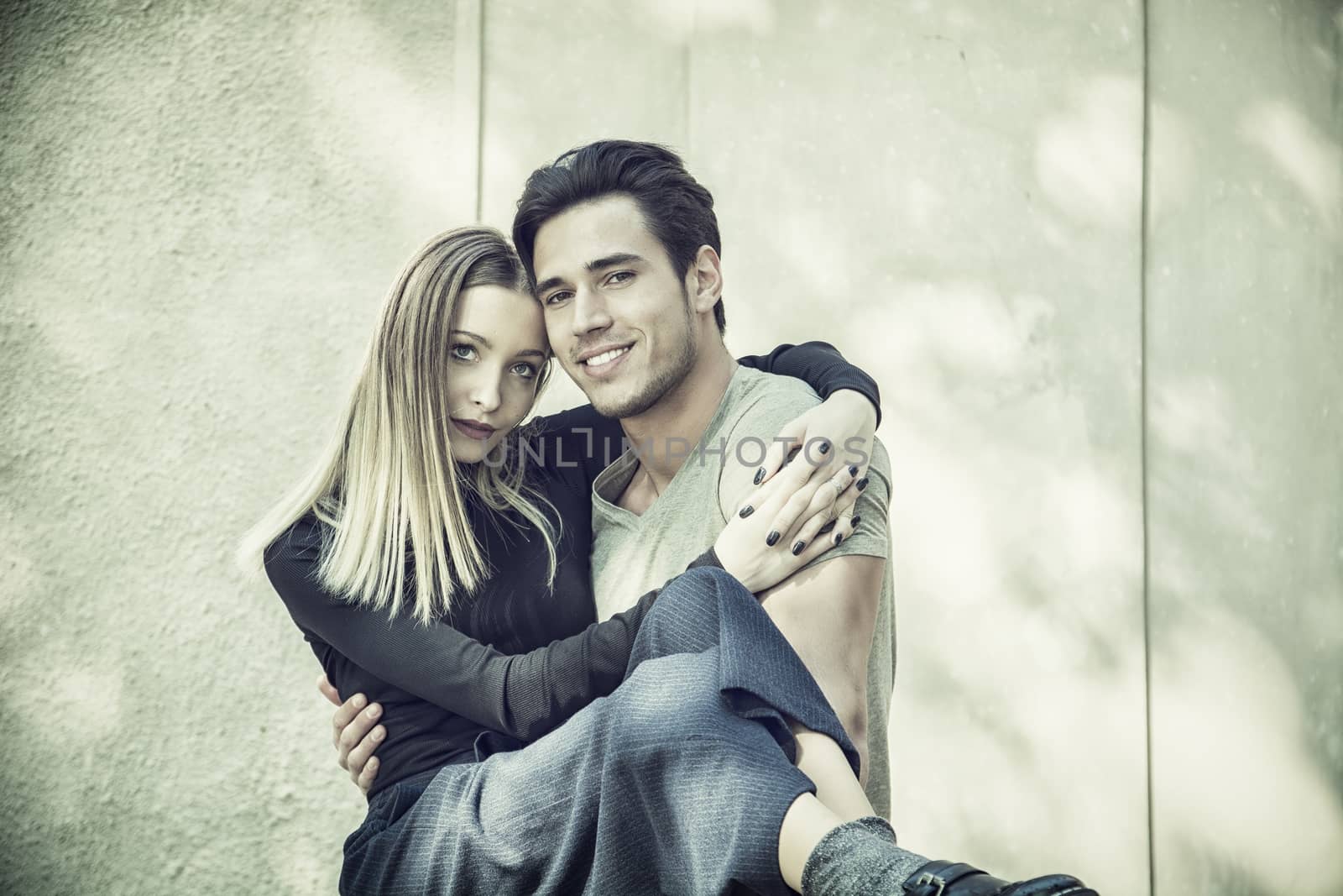 Attractive romantic couple, young man and girl standing by artofphoto
