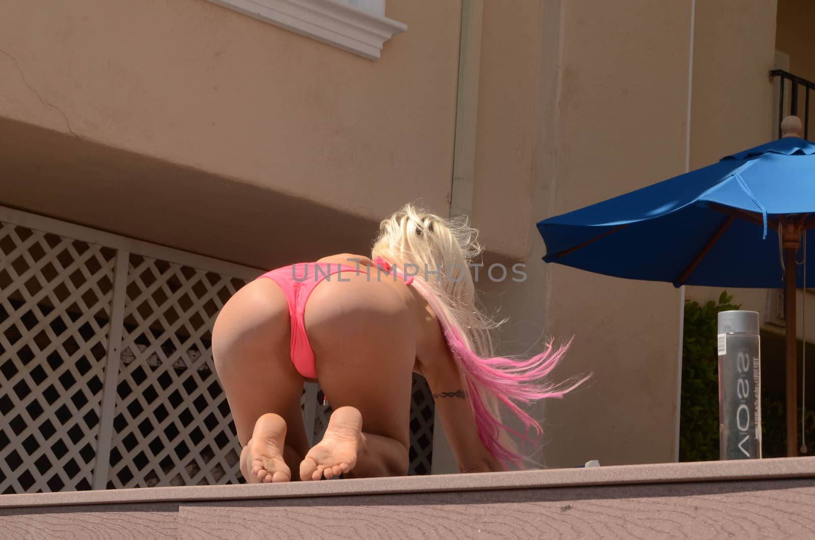 Frenchy Morgan the "Celebrity Big Brother" Star is spotted in a tiny pink bikini tanning, texting and taking selfies, Malibu, CA 05-09-17/ImageCollect by ImageCollect