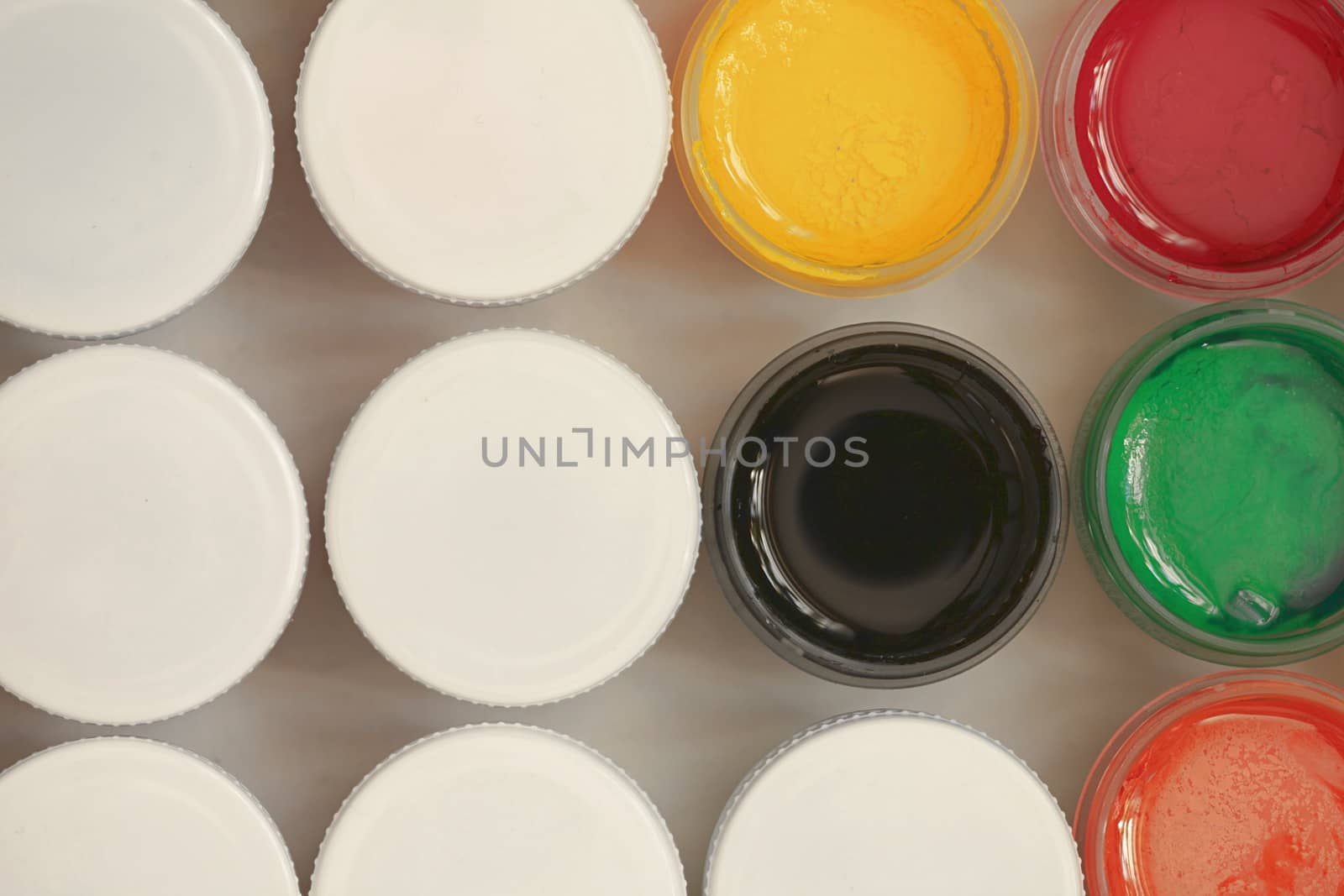 Colorful Gouache set of artistic cans Macro shot top view