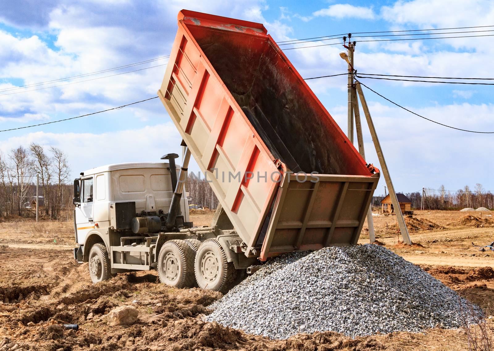 Dumptruck in action on a construction site by Nobilior