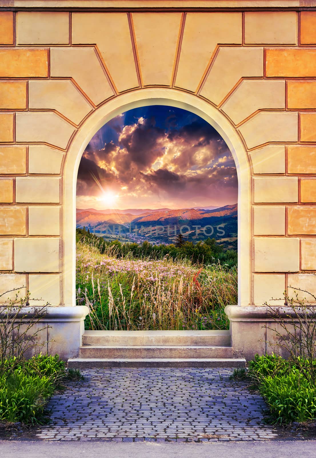 Frame of desolate immured door with picture of mountain meadow on sunrise and steps of cut stone