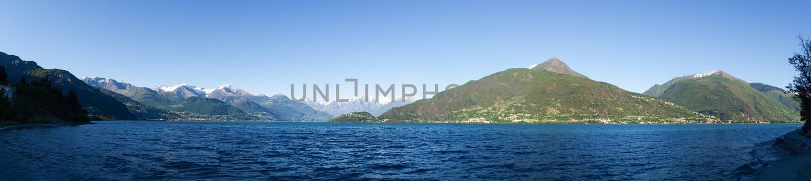 Panorama of the Lake of Como from the Beach at evening sunlight by mauro_piccardi