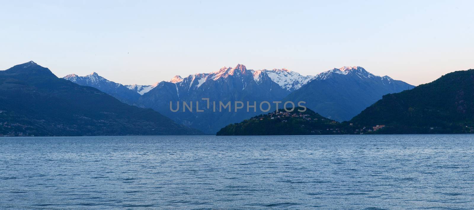 Panorama of the Lake of Como from the Beach at evening sunlight by mauro_piccardi