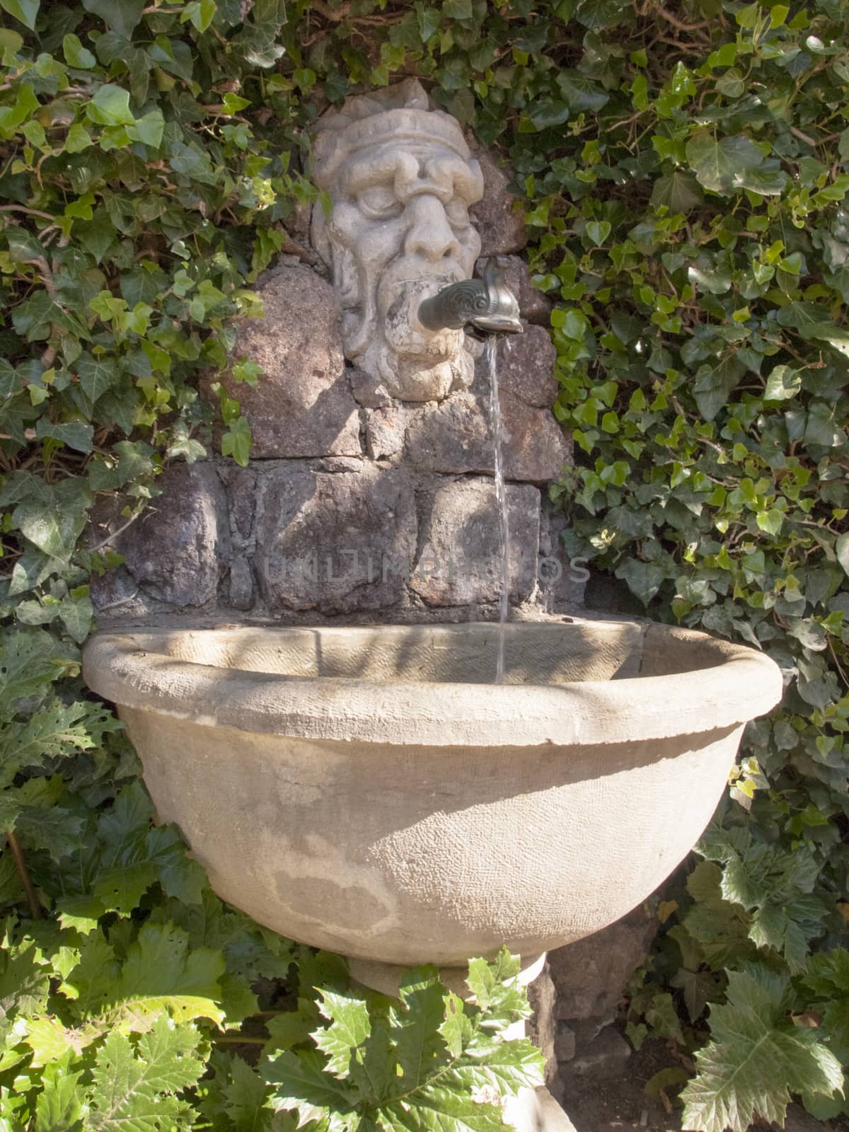 Lugano Castagnola, Switzerland - April 8, 2015: Stone sink headed for the water leak