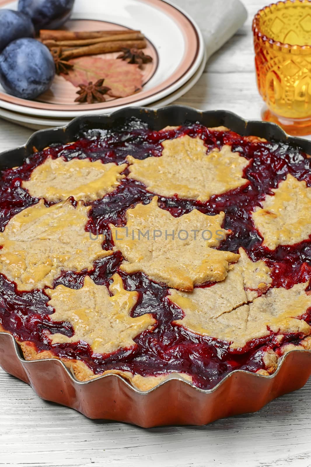 Harvest pie with autumn plums with autumn style