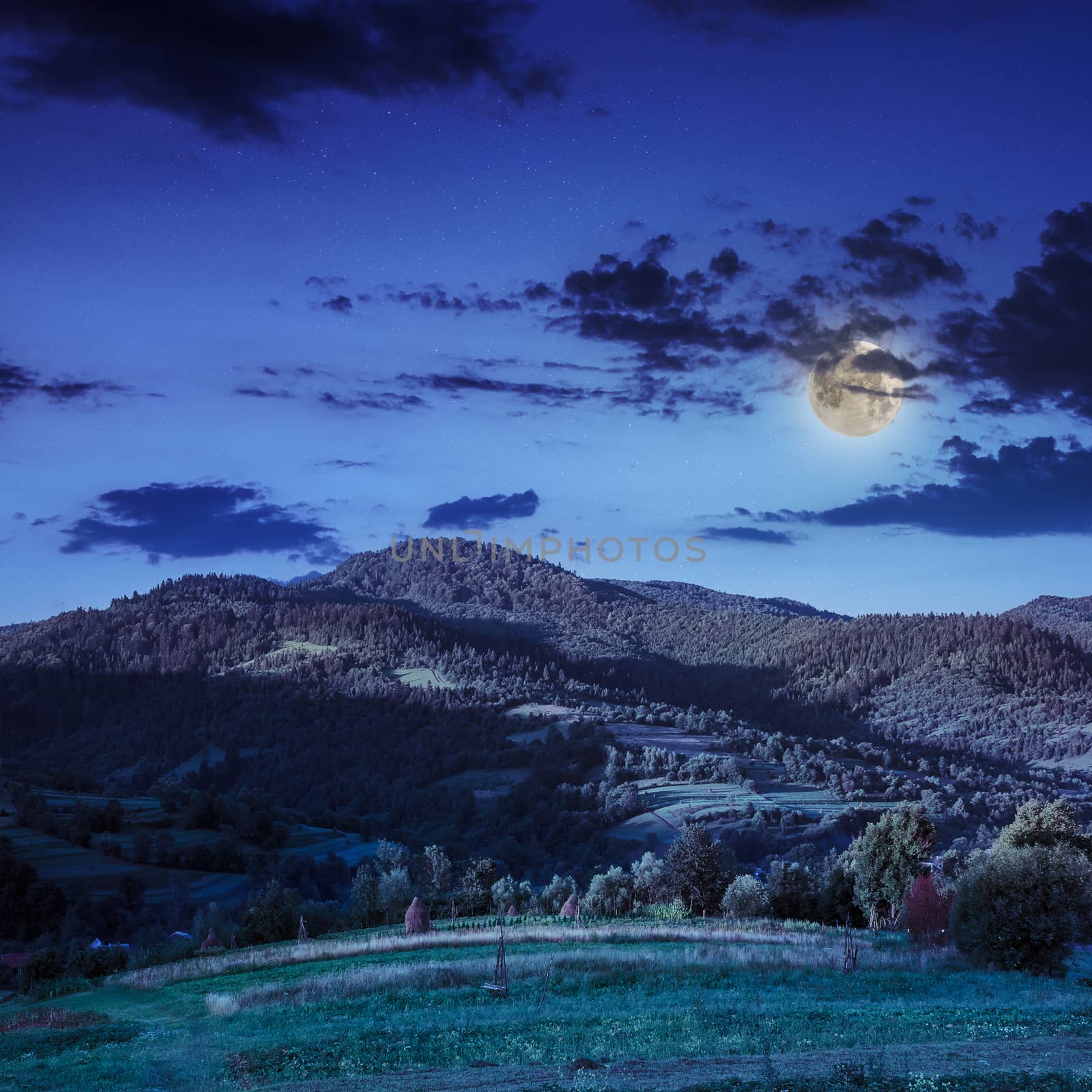 cold morning fog with red hot sunrise in the mountains in moon light