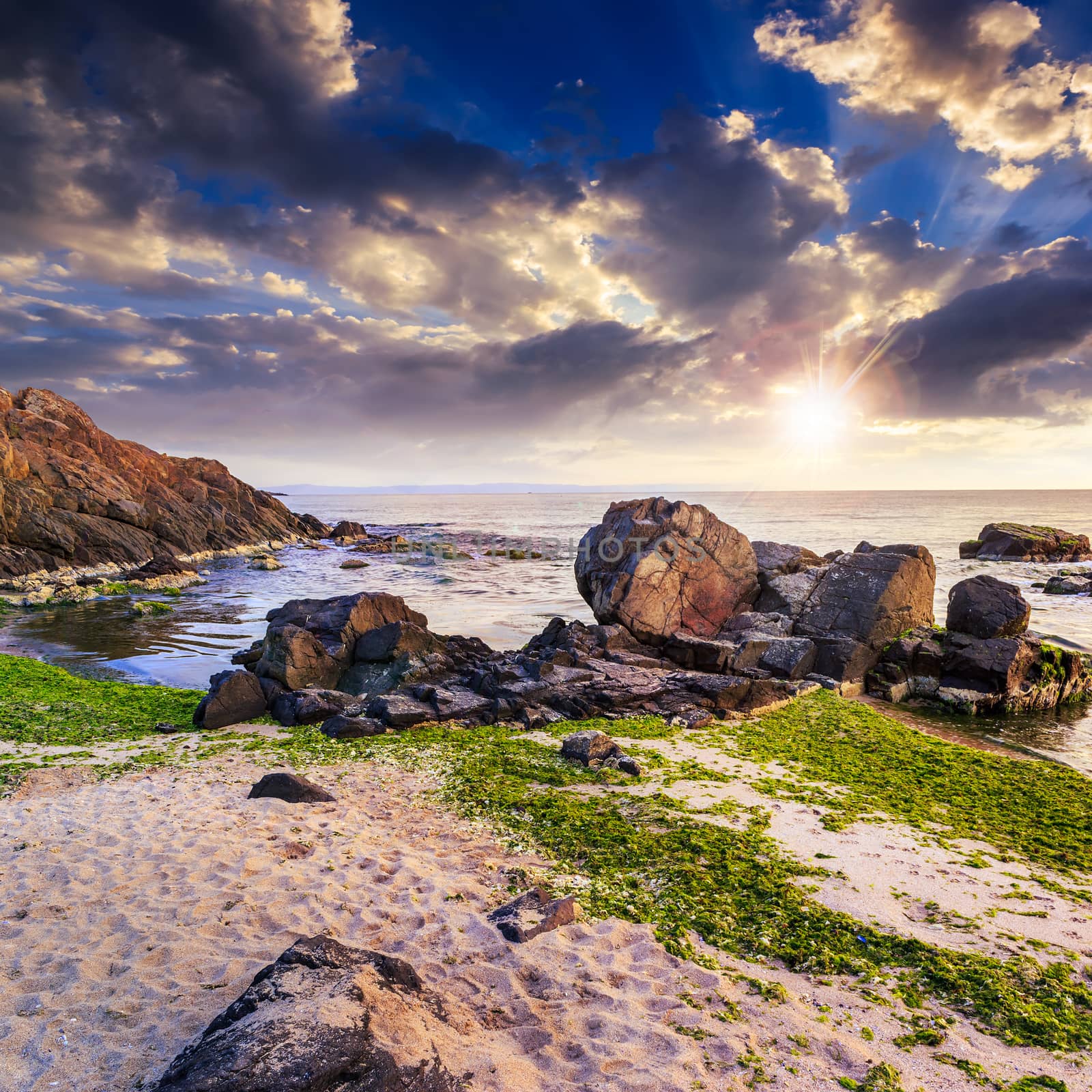 sea ​​waves breaking on the sandy beach at sunset by Pellinni