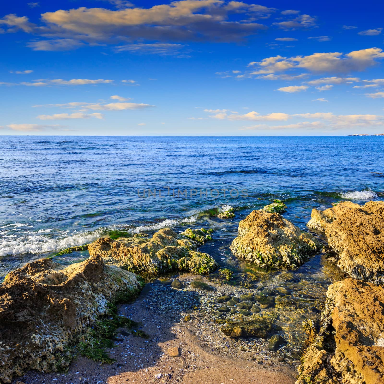 sea wave breaks about boulders by Pellinni