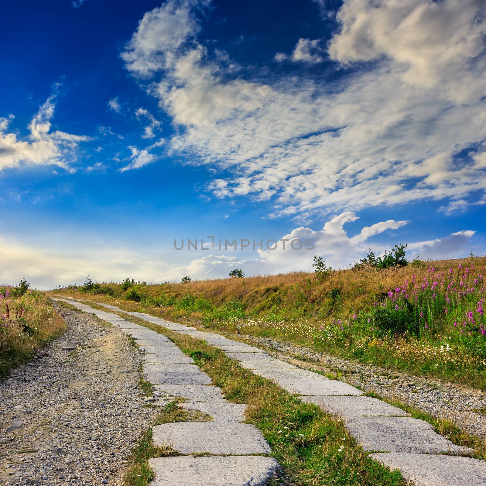 road of concrete slabs uphill to the sky by Pellinni