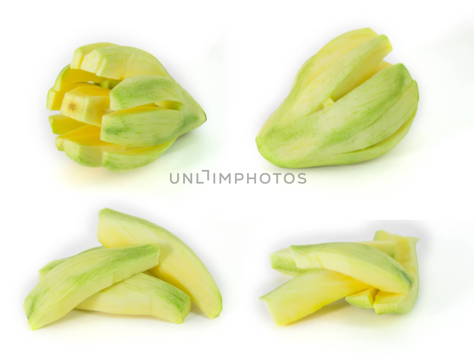 green sweet mango cut isolated on white