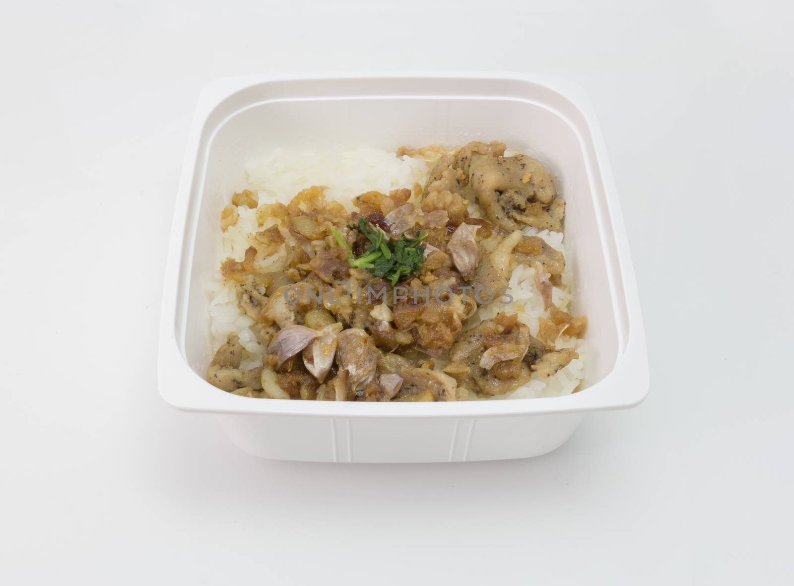 instant meal garlic pork with rice isolated on white