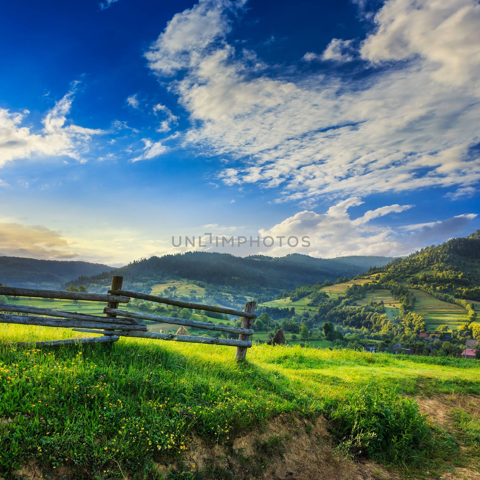 wooden fence in the grass on the hillside by Pellinni