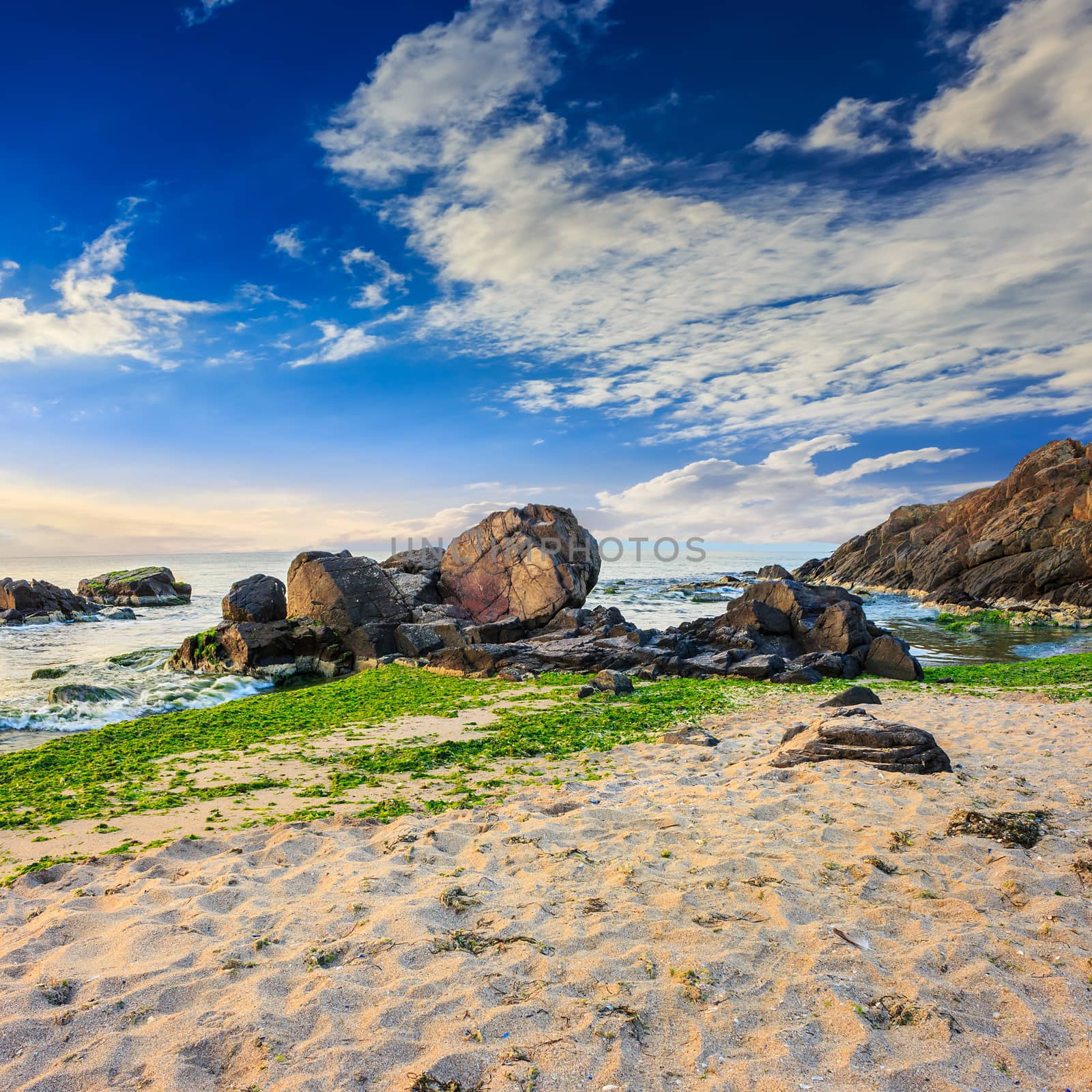 sea wave breaks about boulders by Pellinni