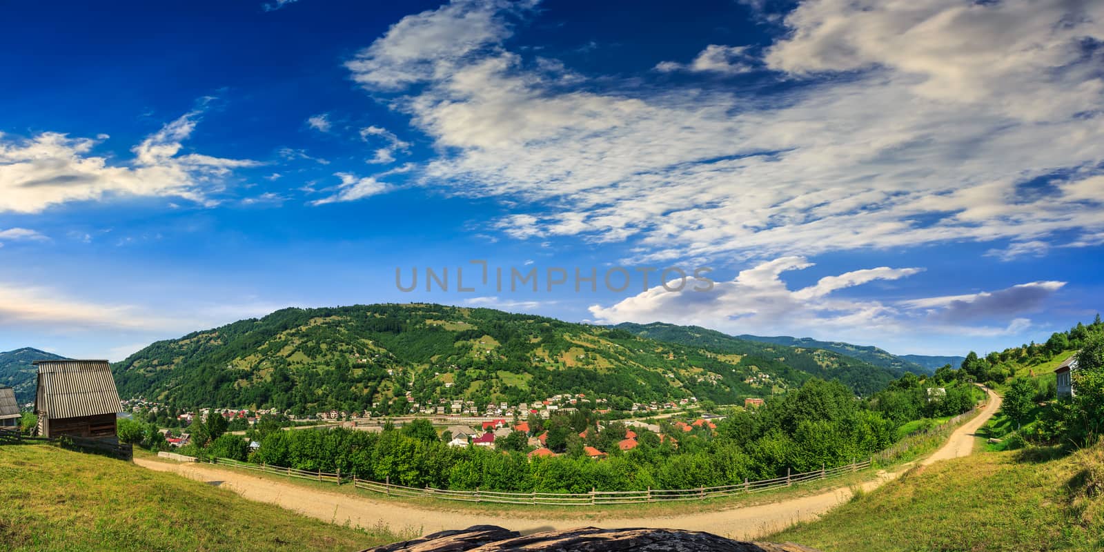 village on hillside of mountain by Pellinni