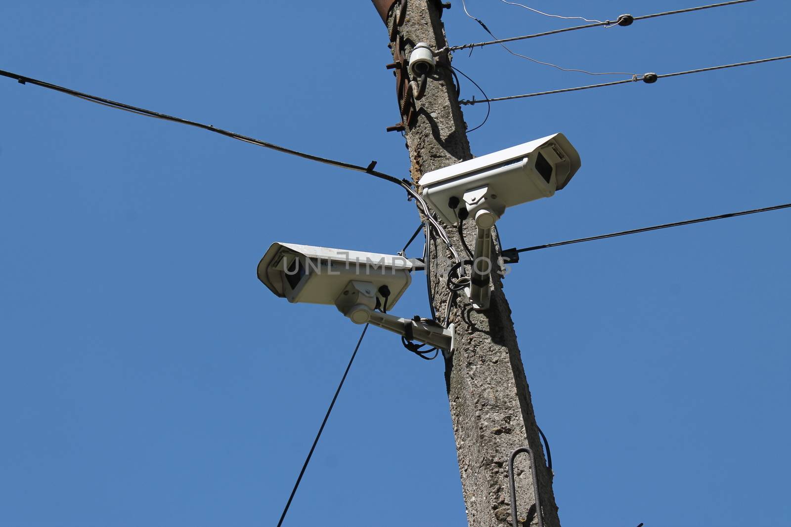 CCTV camera hanging over the entrance of a house by nolimit046