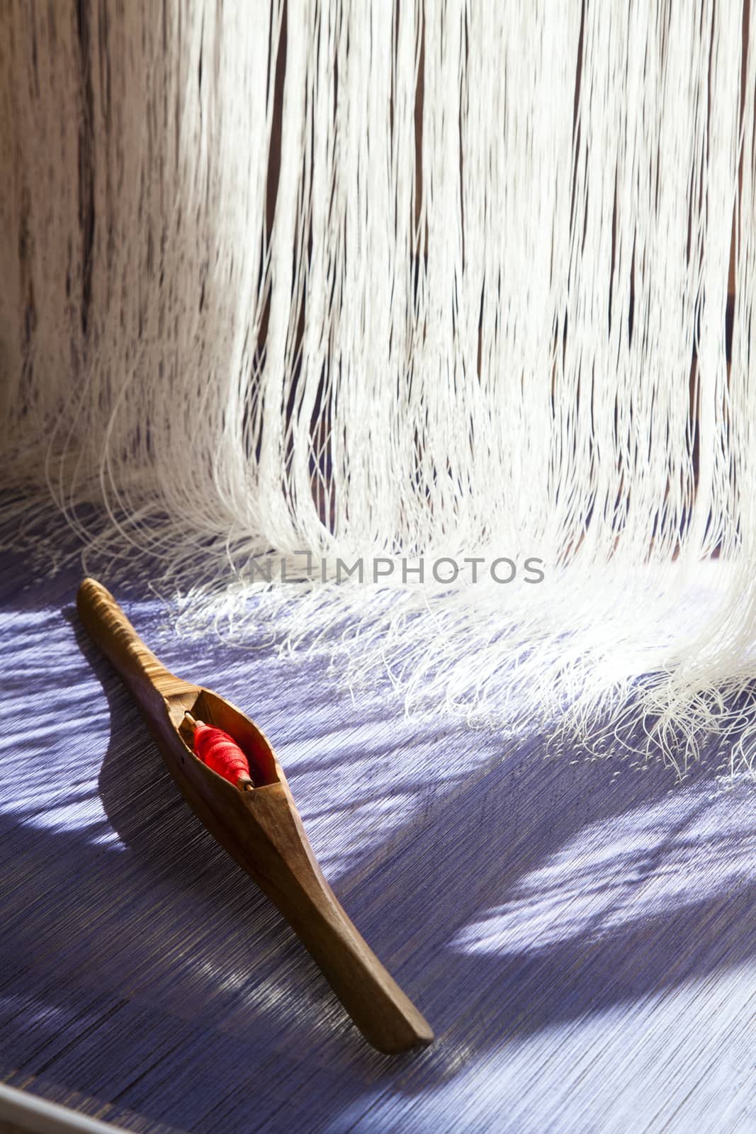 old weaving Loom and thread of yarn. by jee1999