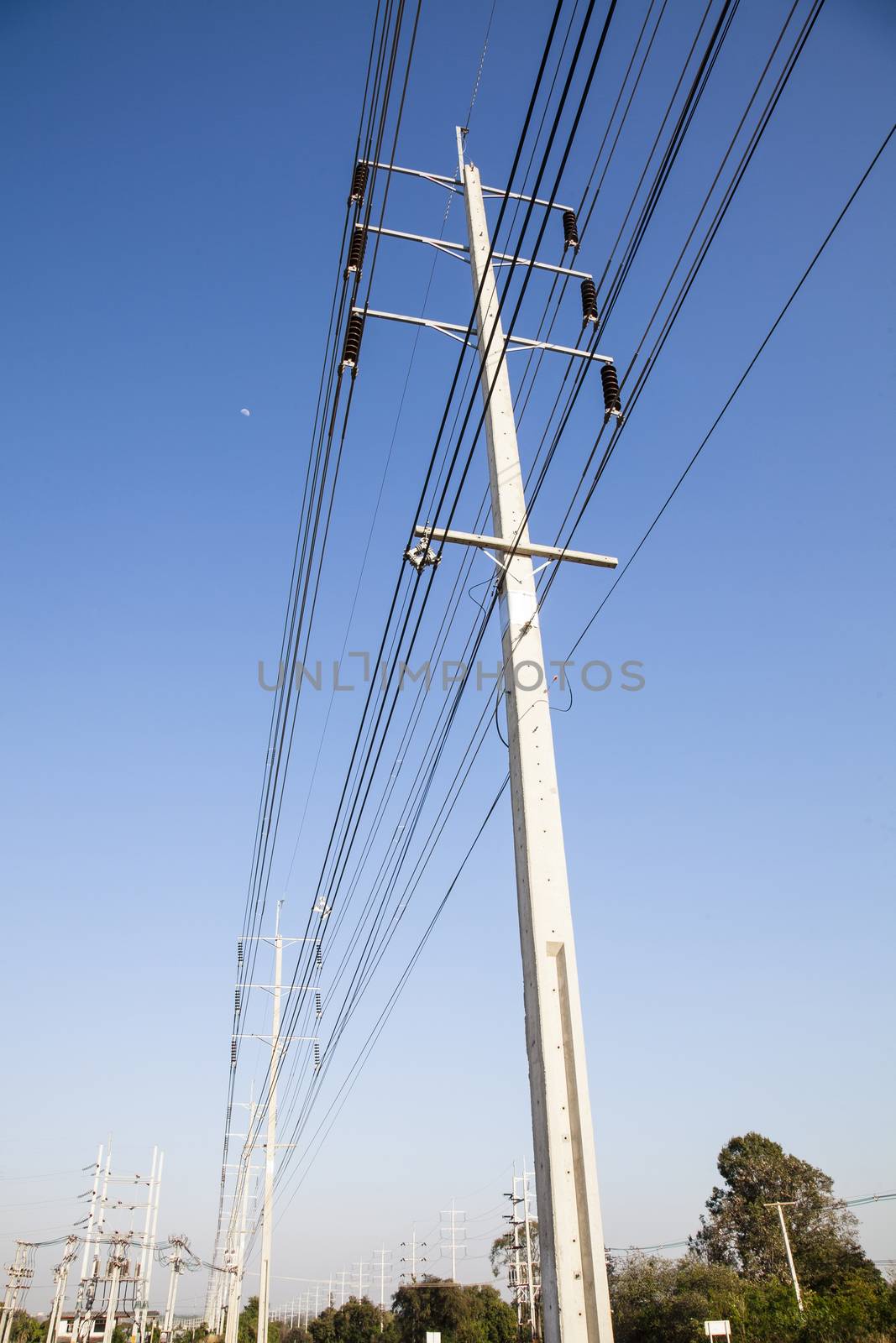  Electrical power poles in The electricity needed to power an el by jee1999