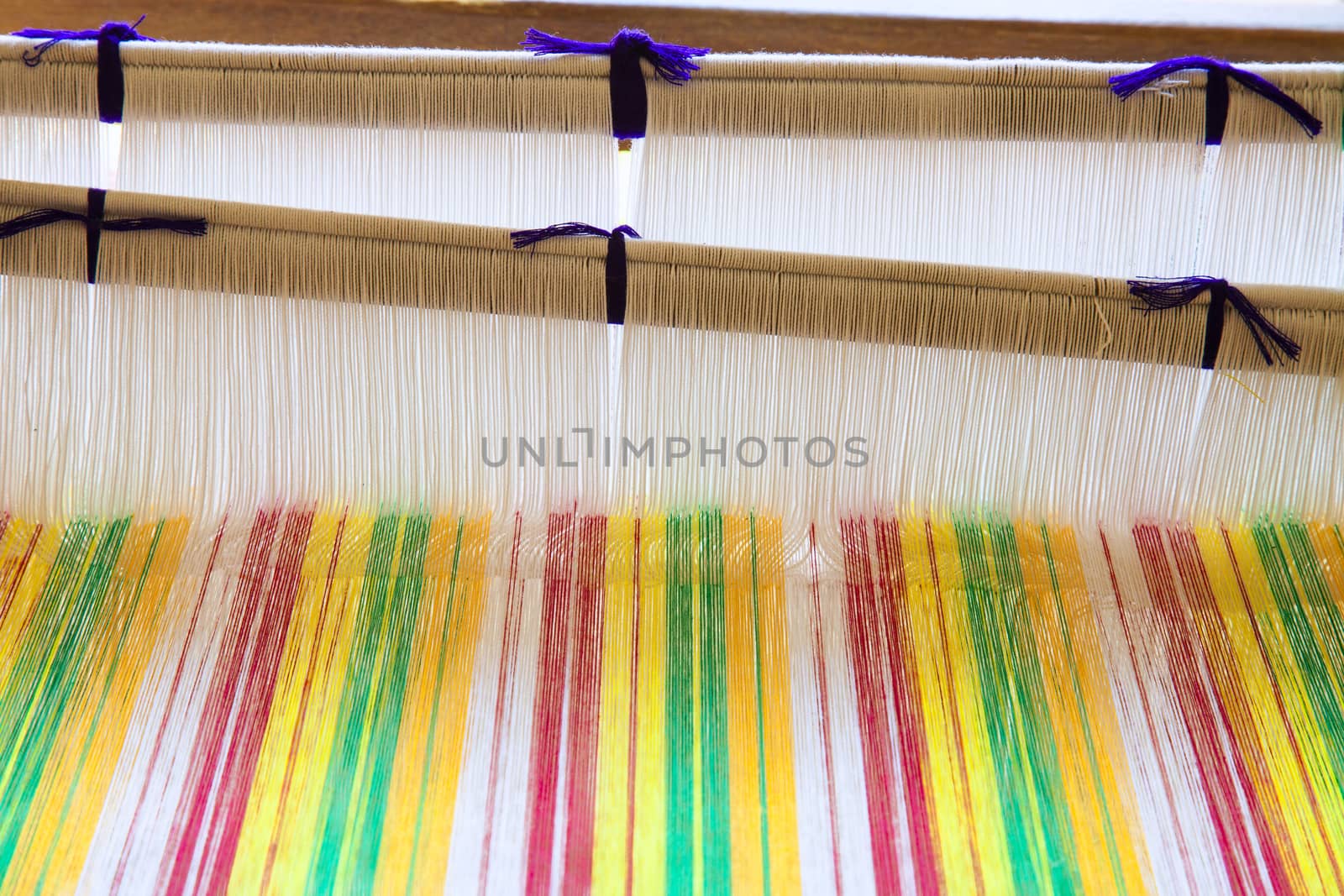 old weaving Loom and thread of yarn. by jee1999