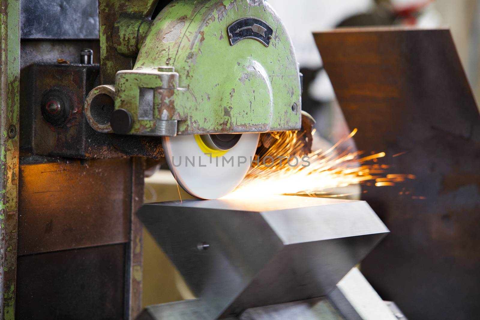 metalworking industry. finishing metal surface on horizontal grinder machine