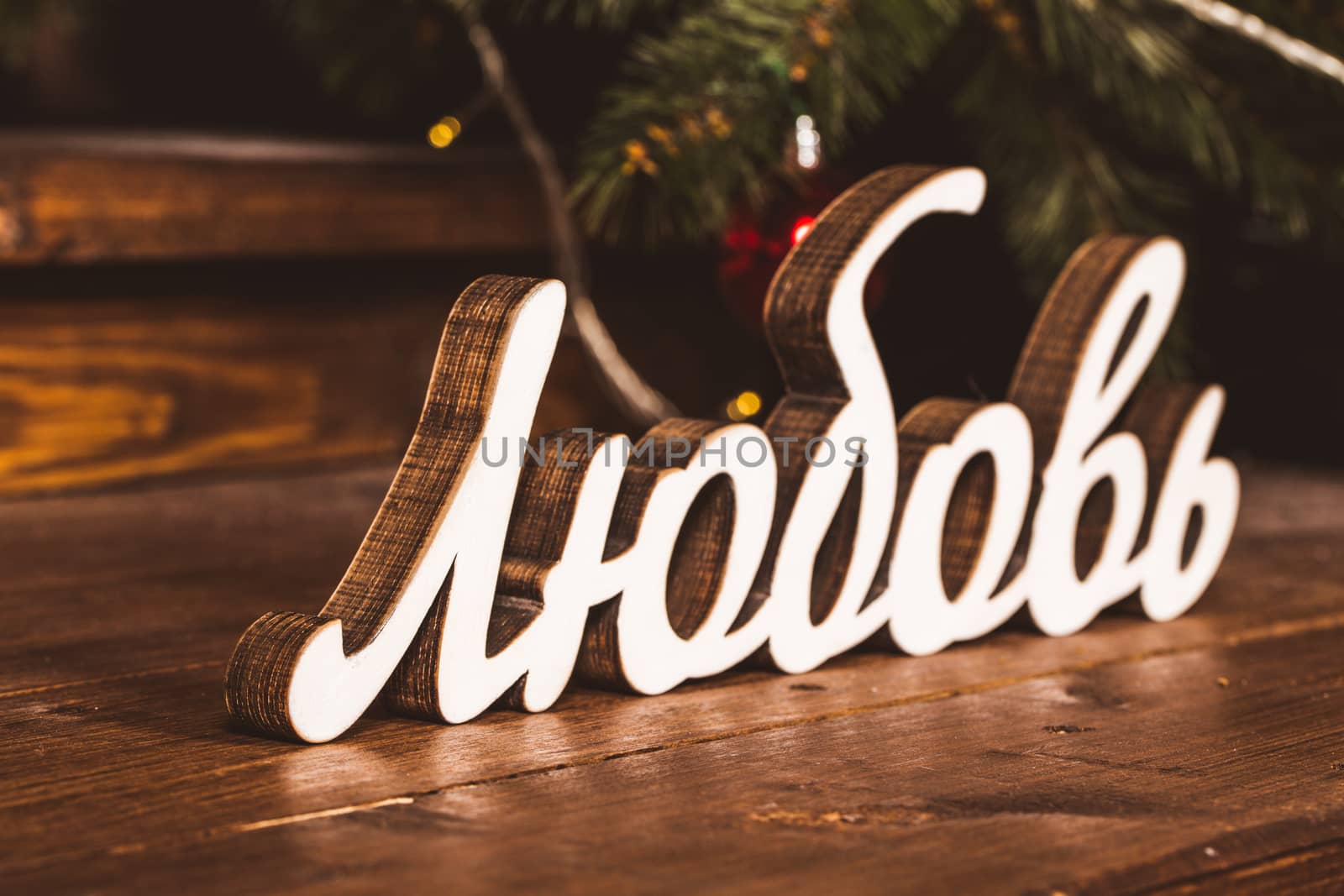 Inscription Love on wooden background