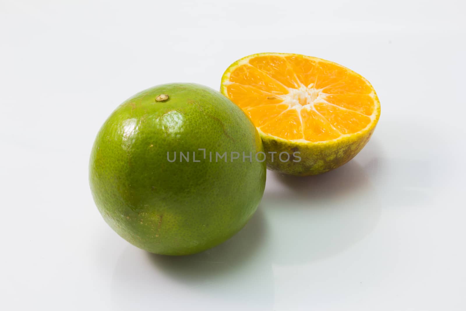 fresh tangerine orange isolated  on white background by chingraph