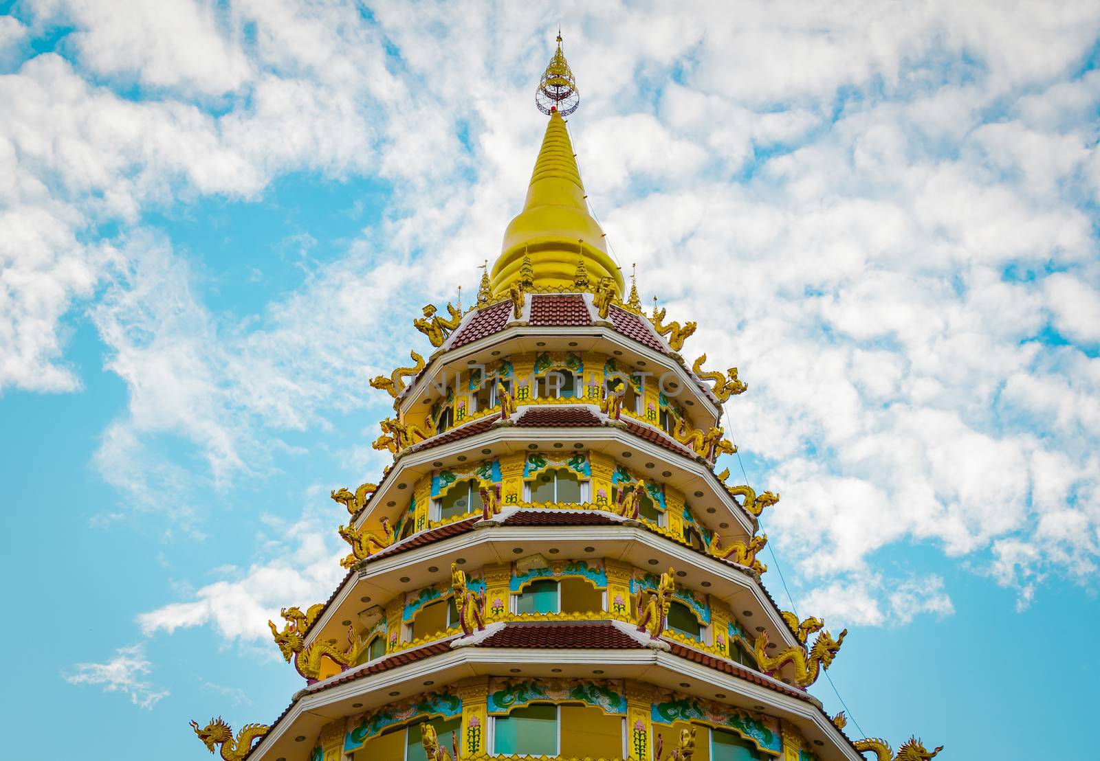 Thai style pagoda of Wat Huay Pla Kung Temple Chiang Rai Thailan by chingraph