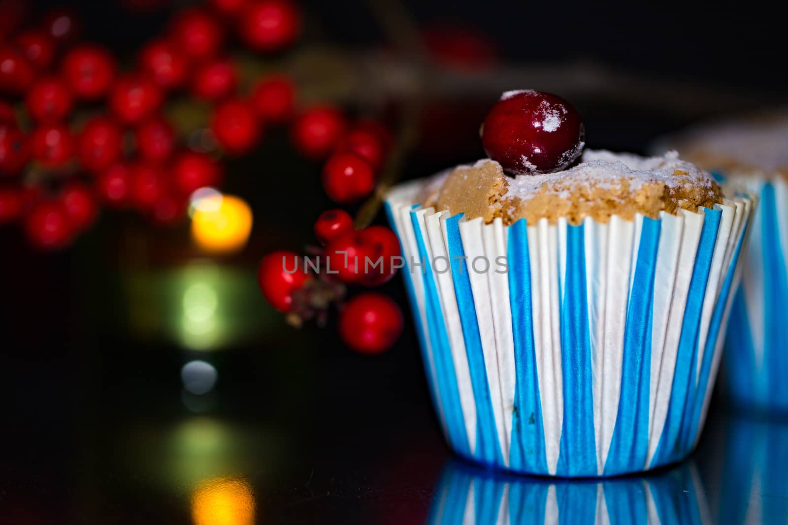 candle,ashberry and Capcake on the black backgraund