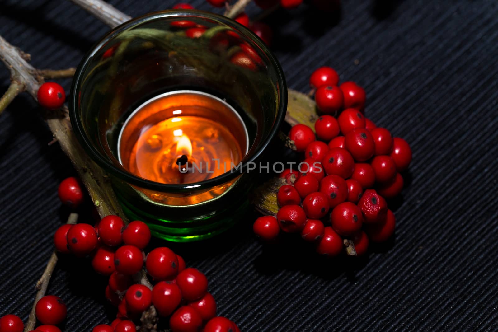 candle,ashberry and box on the black backgraund