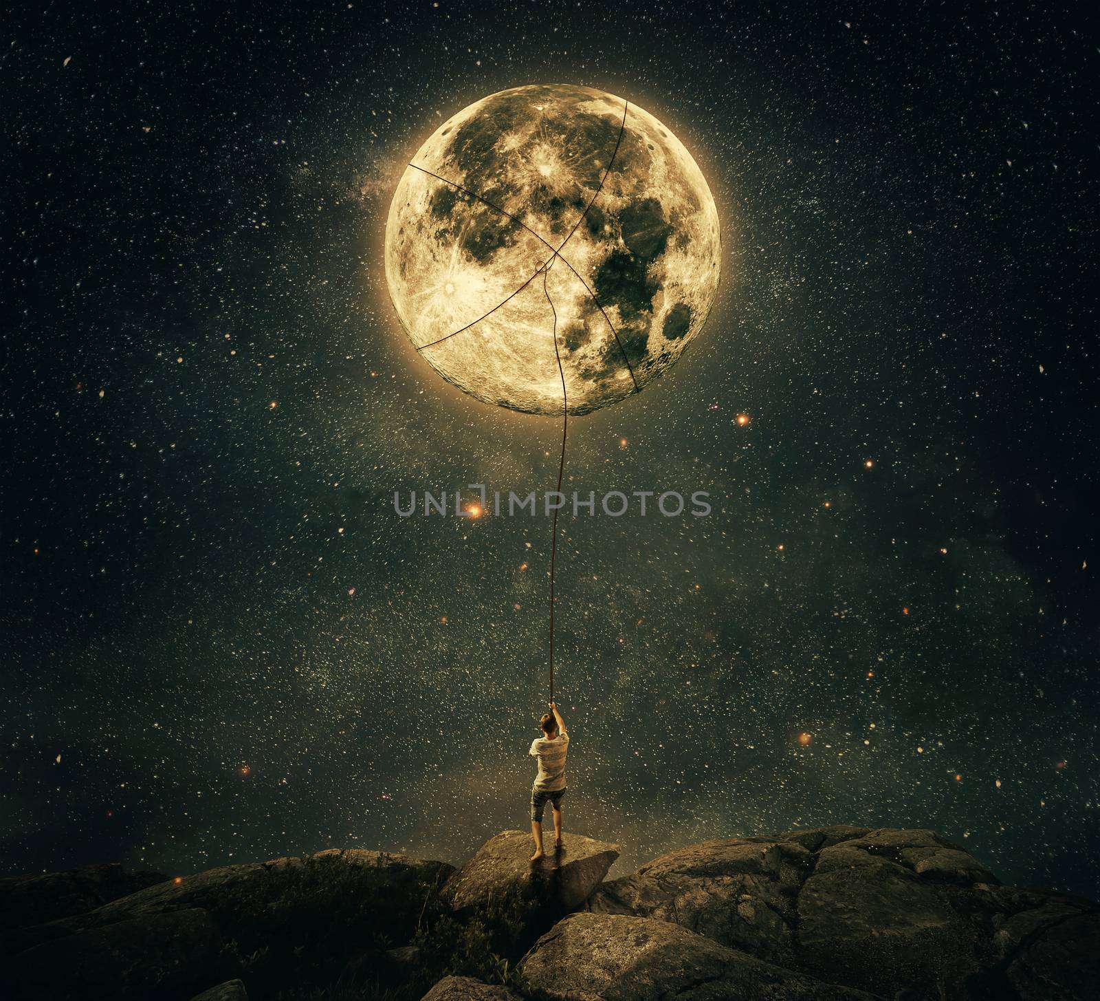 Imaginary view as a young man, holding a rope, try to catch and pull the full moon from the night sky. Achievement and hard determination concept.