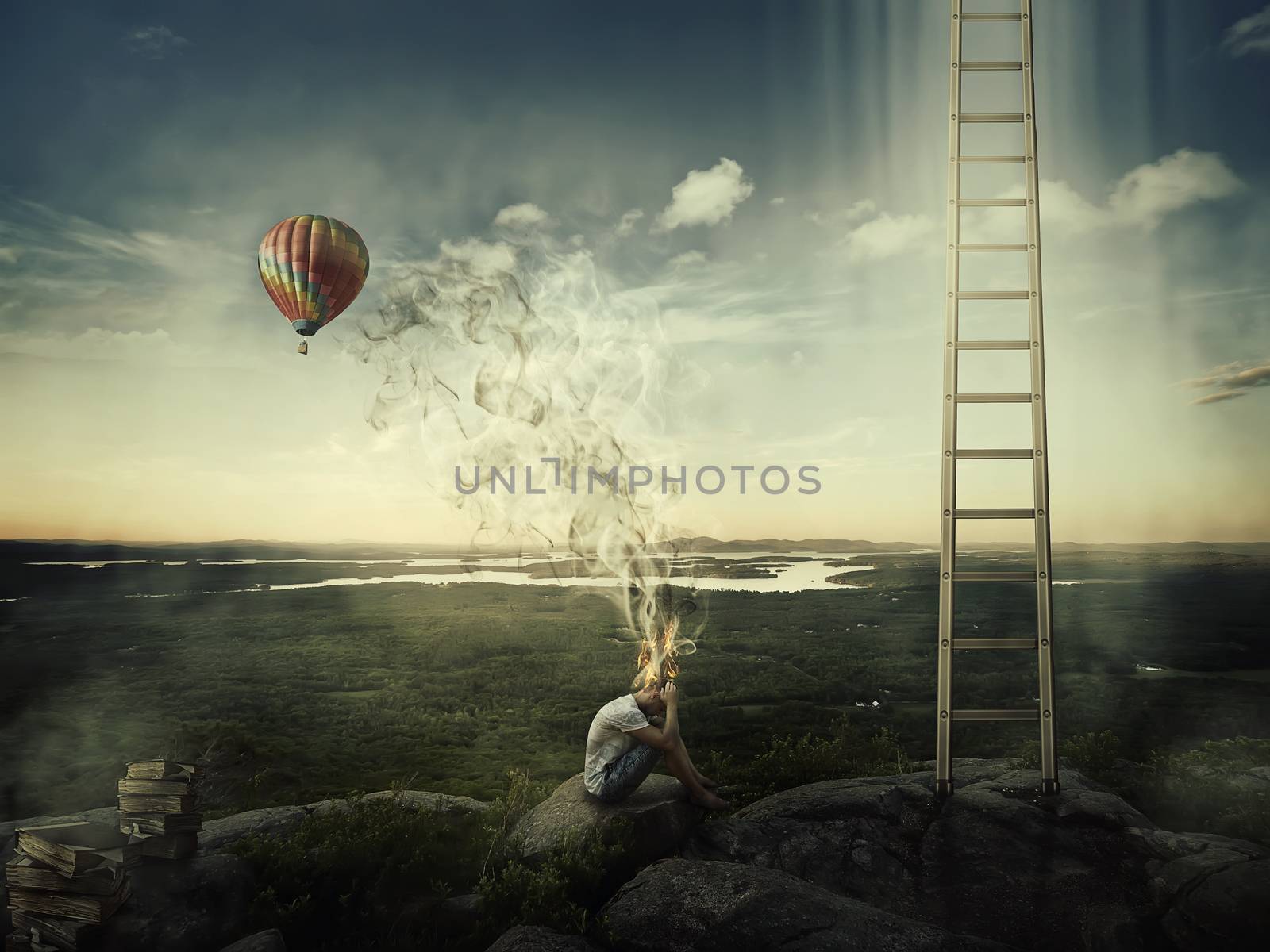 Young boy sit on the top of a hill near a ladder goind up in the sky and a hot air balloon fly over the forest valley. Bad mood, hard thinking, no inspiration concept with his head fired and the smoke rising up.
