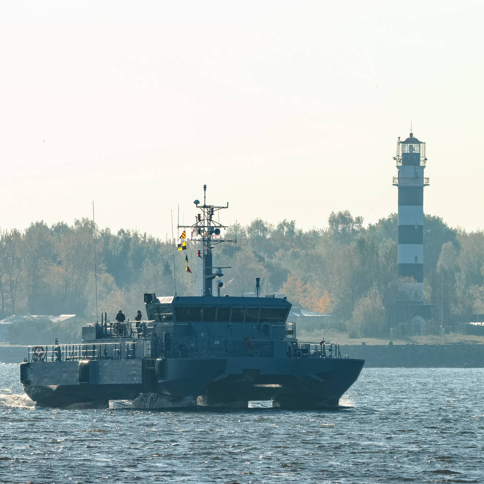 Small grey military ship moving from Baltic sea