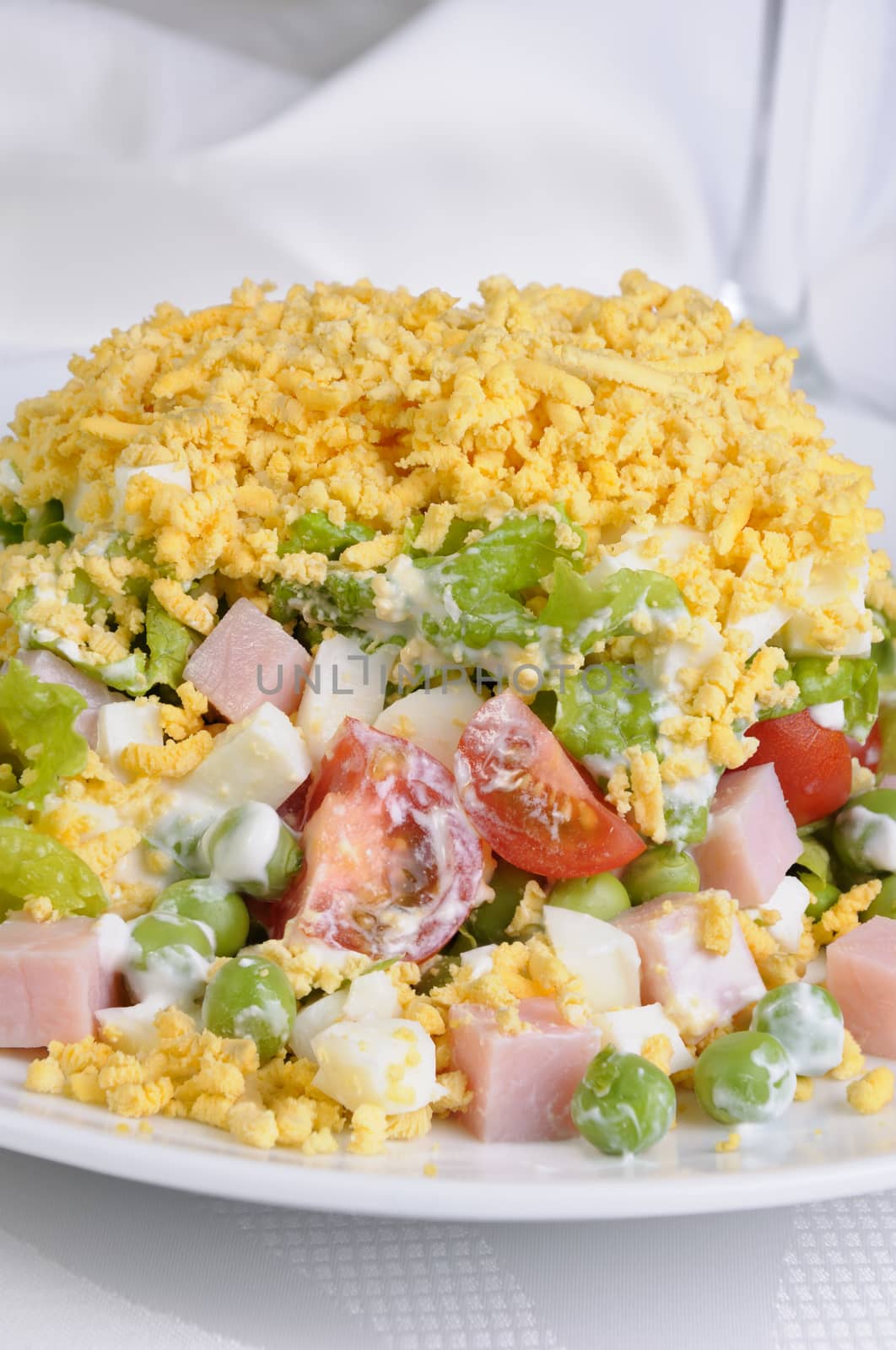 salad with ham and egg and vegetables flavored  milk sauce