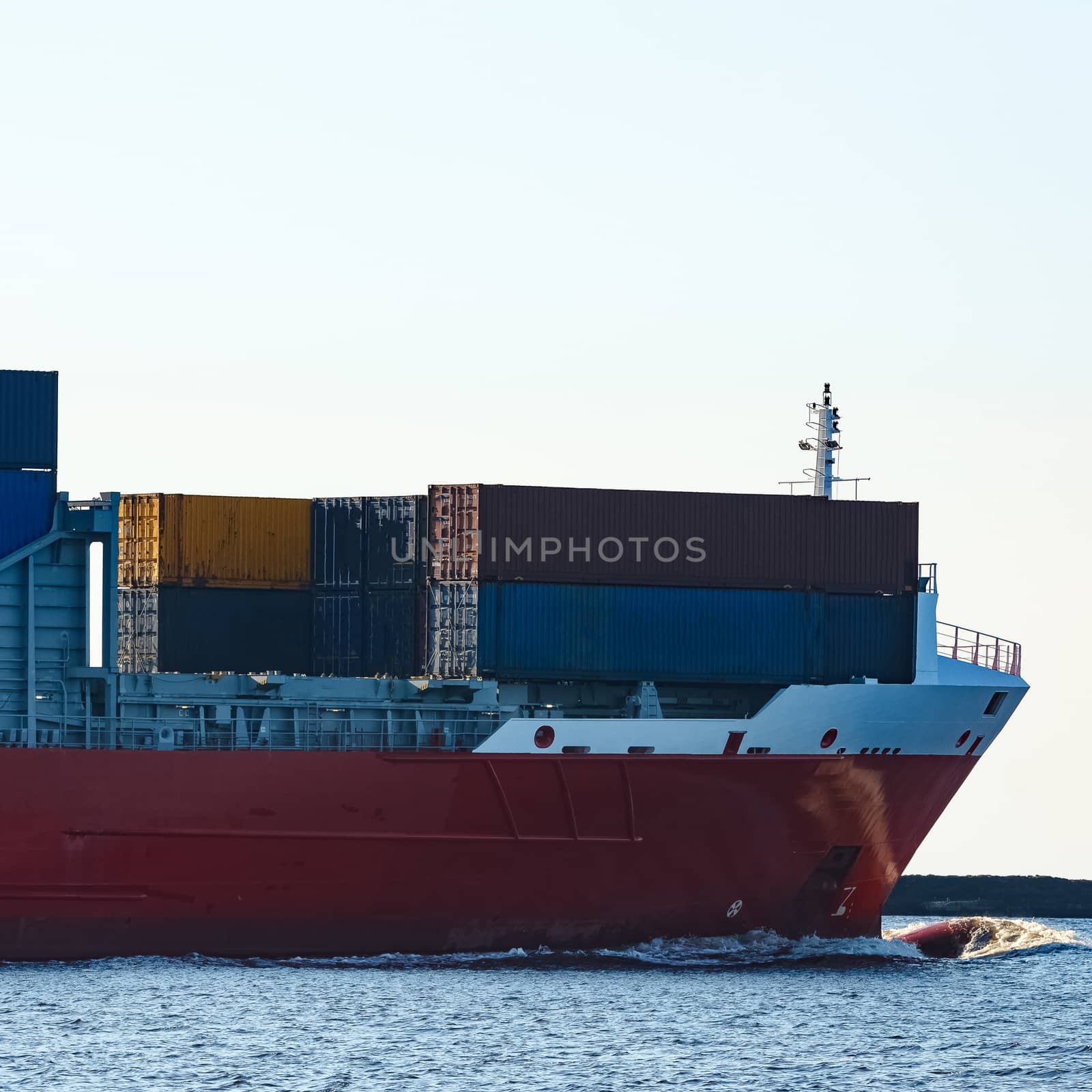Red container ship sailing to the Baltic sea