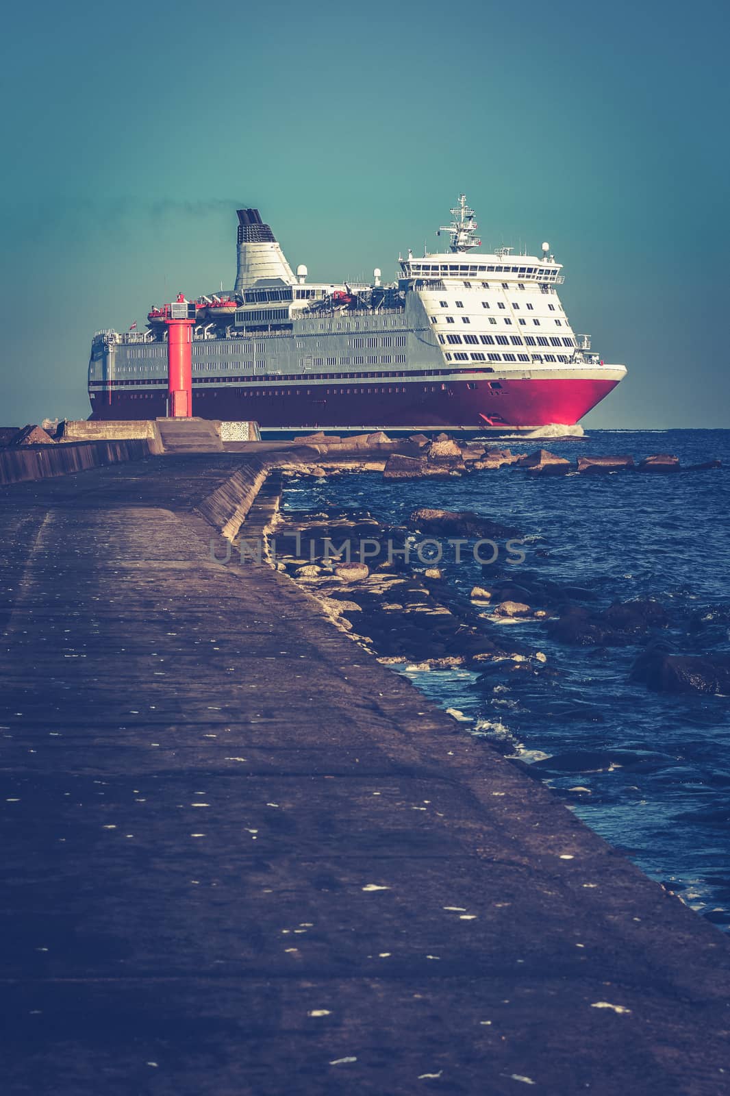 Red cruise liner. Large passenger ferry underway