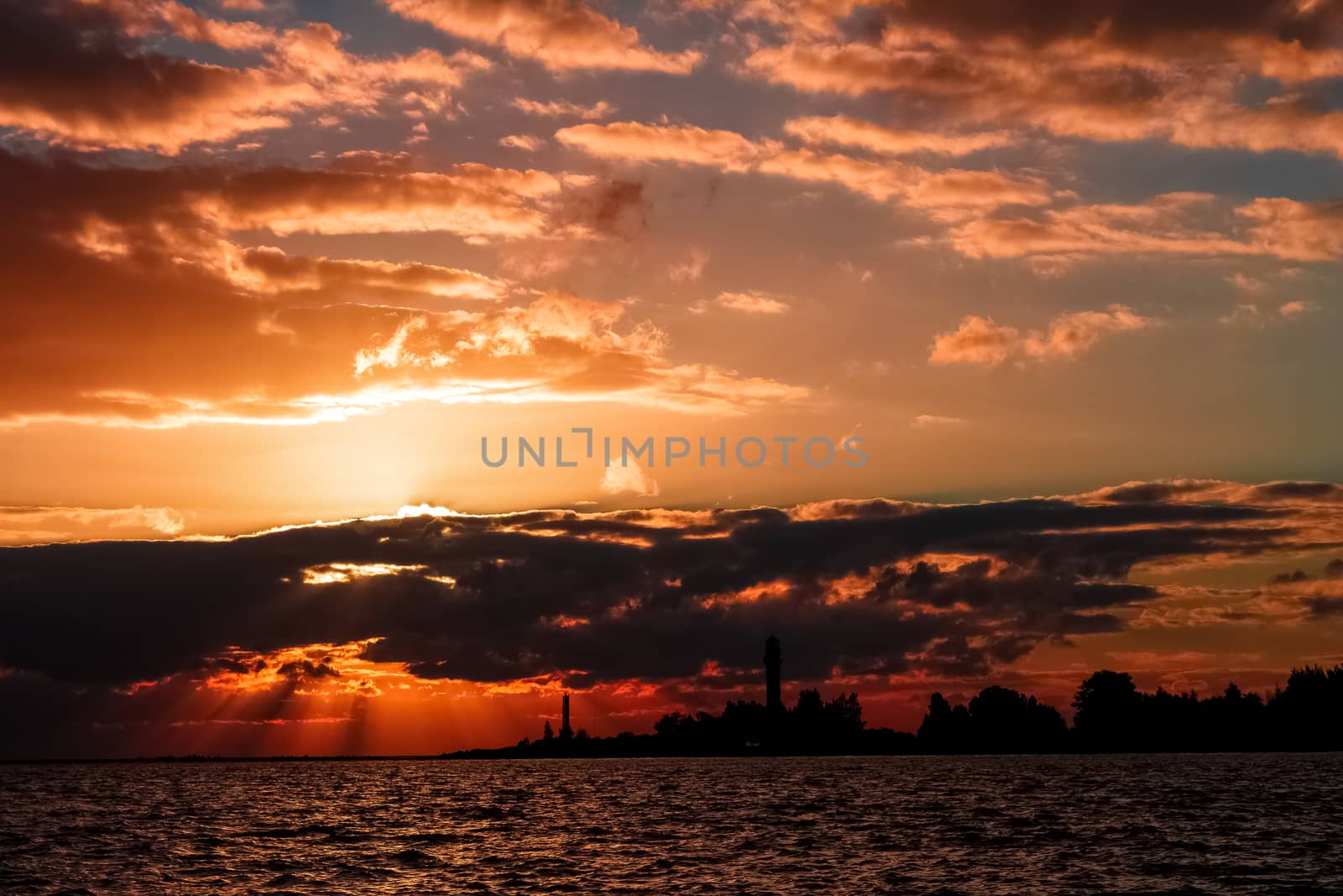Golden sunset sky over the town silhouette