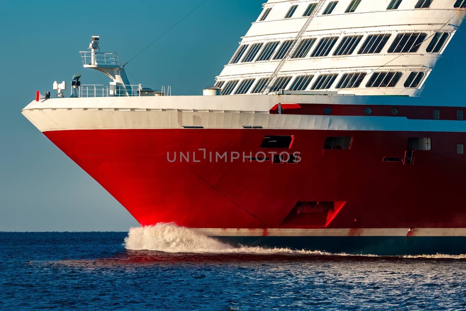 Red cruise liner. Large passenger ferry underway