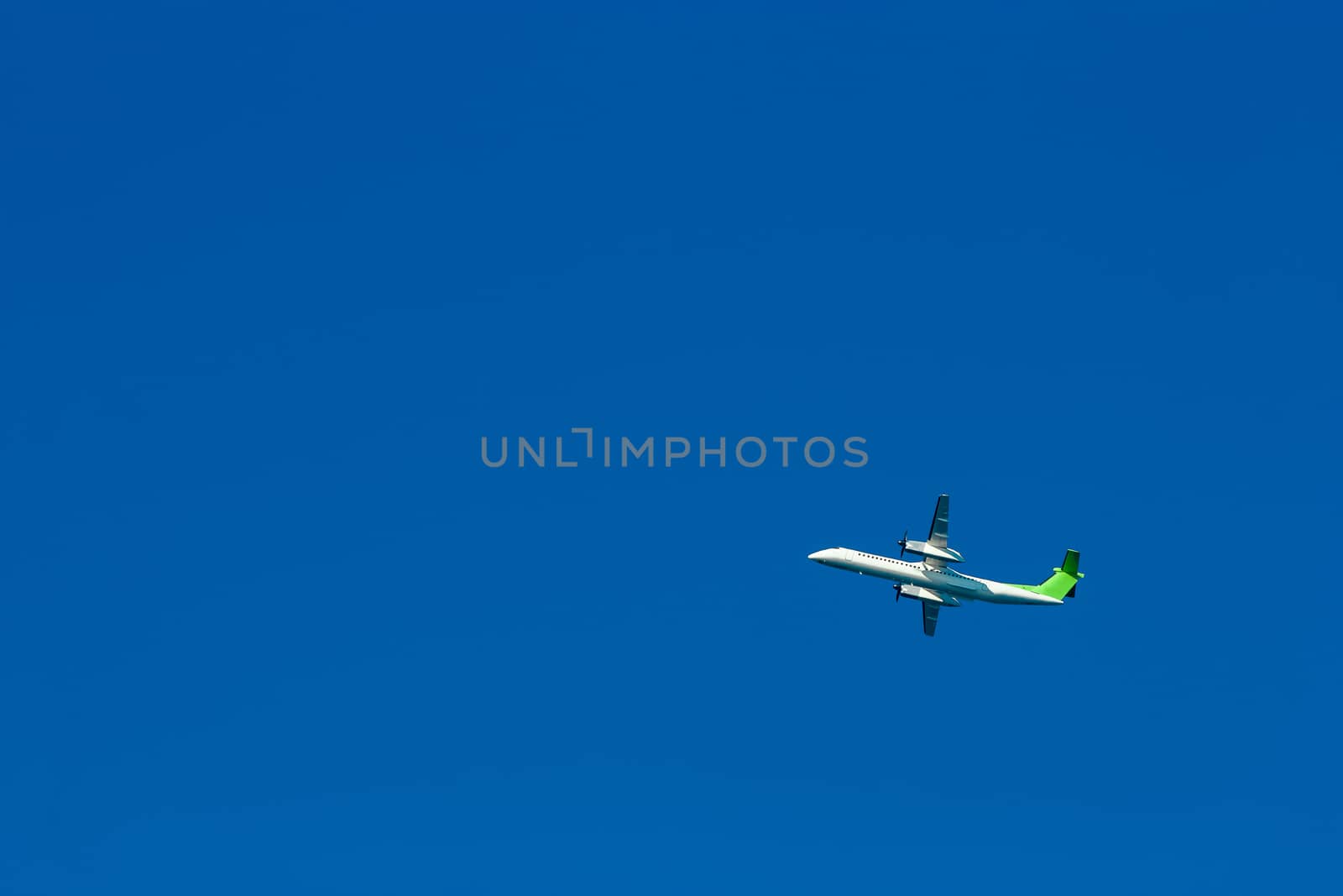 Passenger aircraft flying in the blue sky