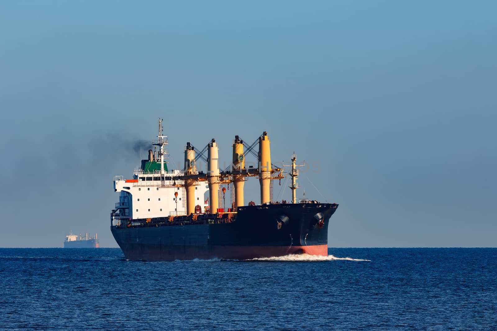 Black cargo ship sailing from the Baltic sea