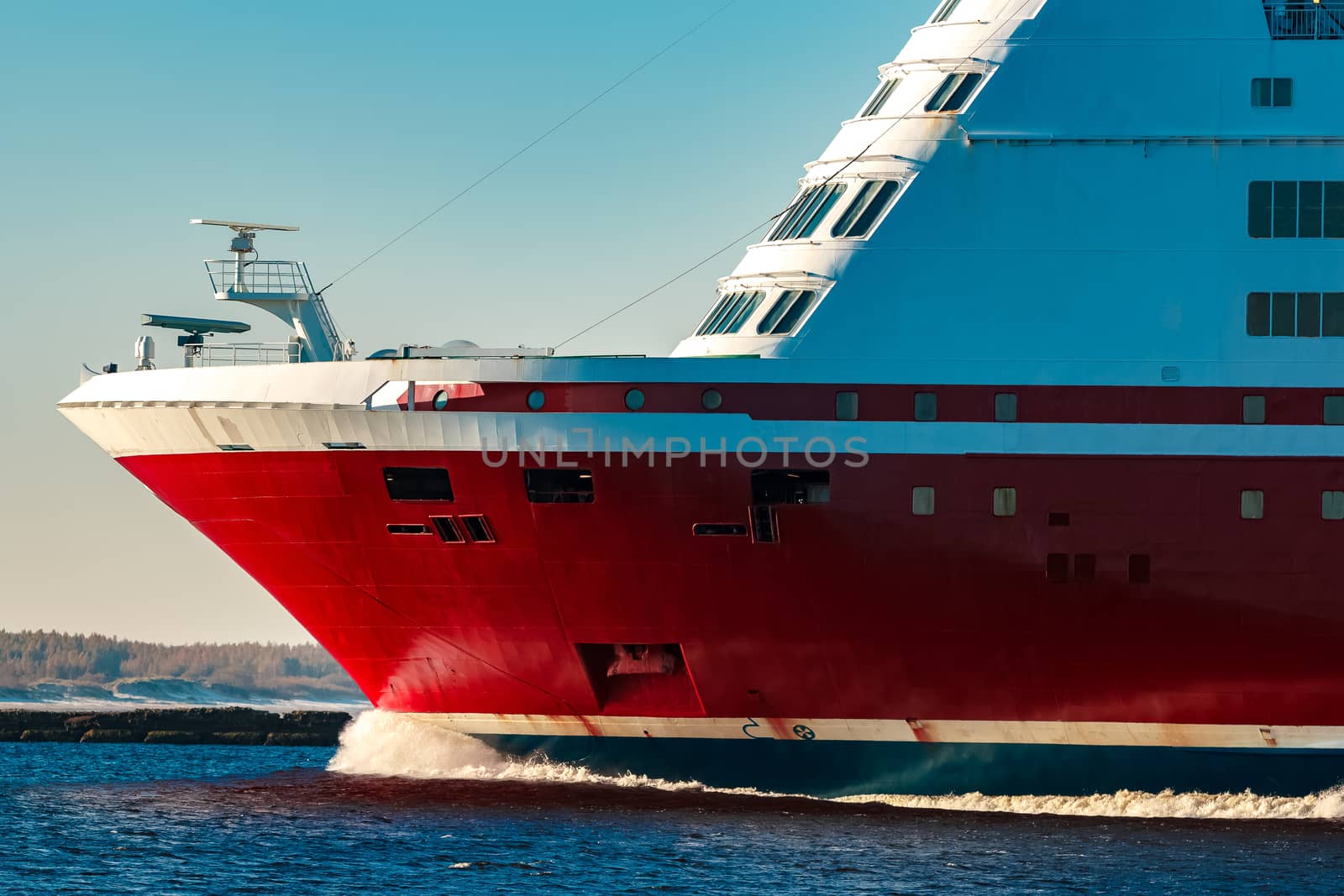 Red cruise liner. Large passenger ferry underway