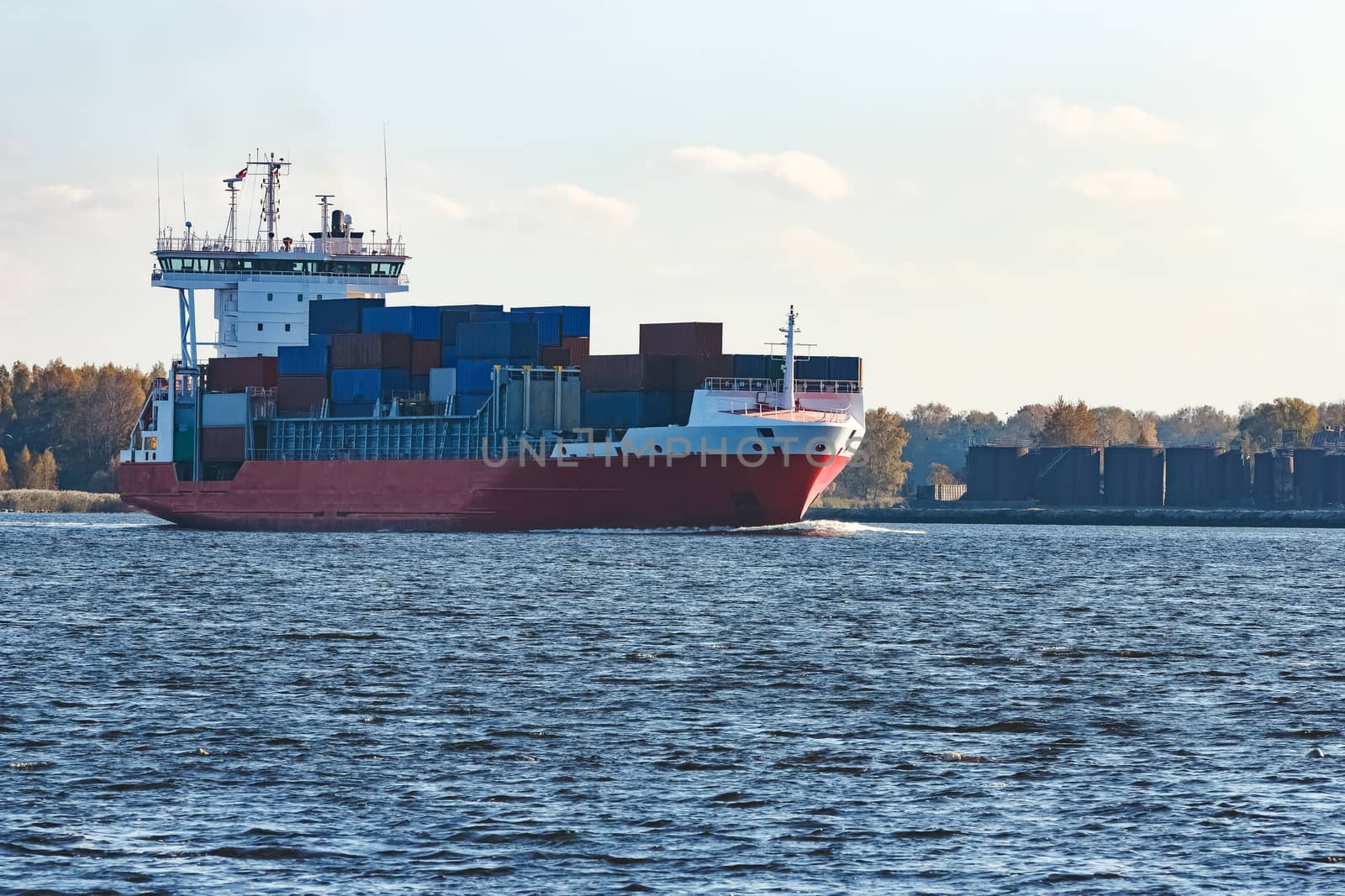 Red container ship sailing to the Baltic sea