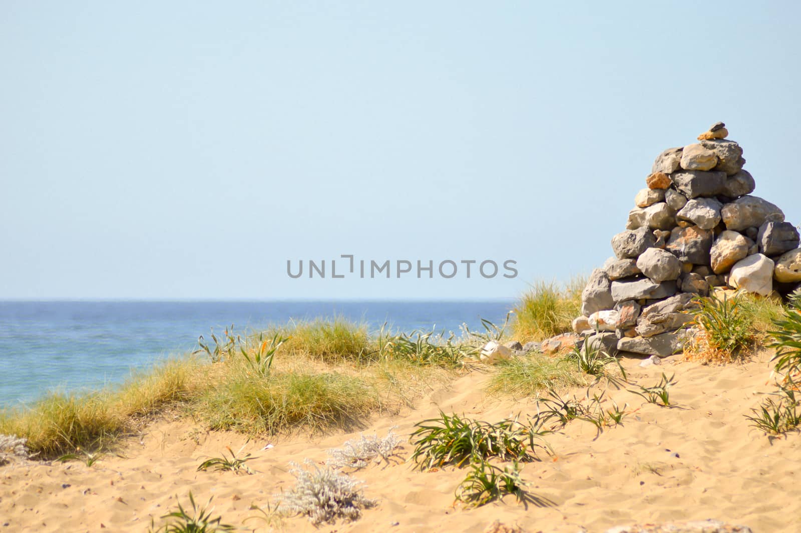 Pebble mound on a sand dune  by Philou1000