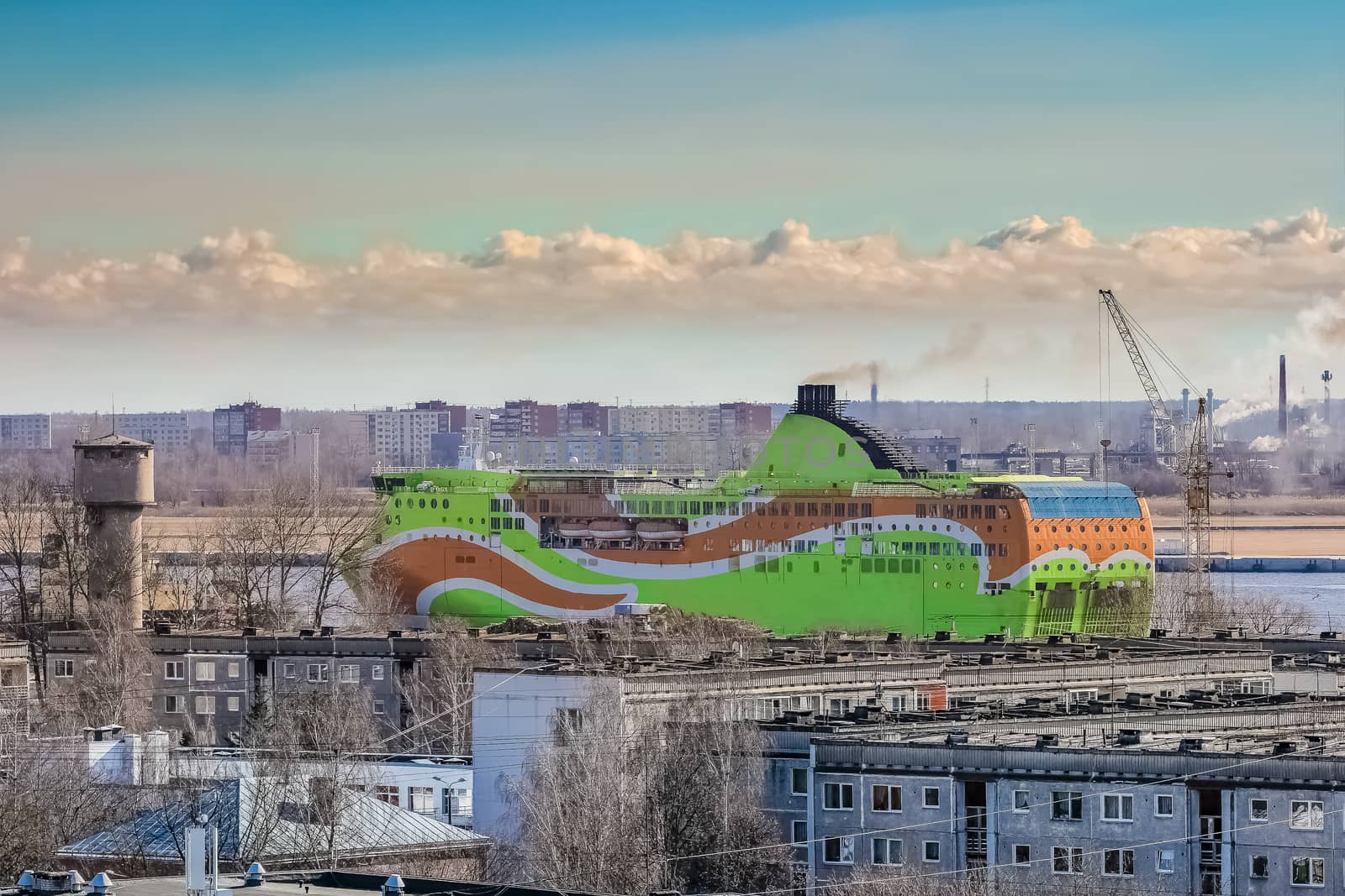 Green cruise liner. Passenger ferry sailing past the Riga city