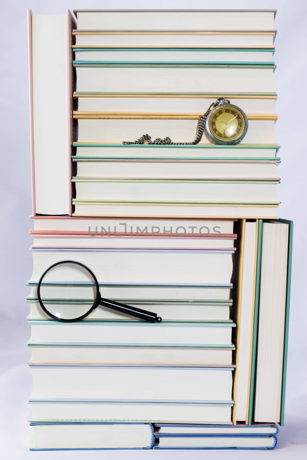 Heap of books on a white isolated background with a nib