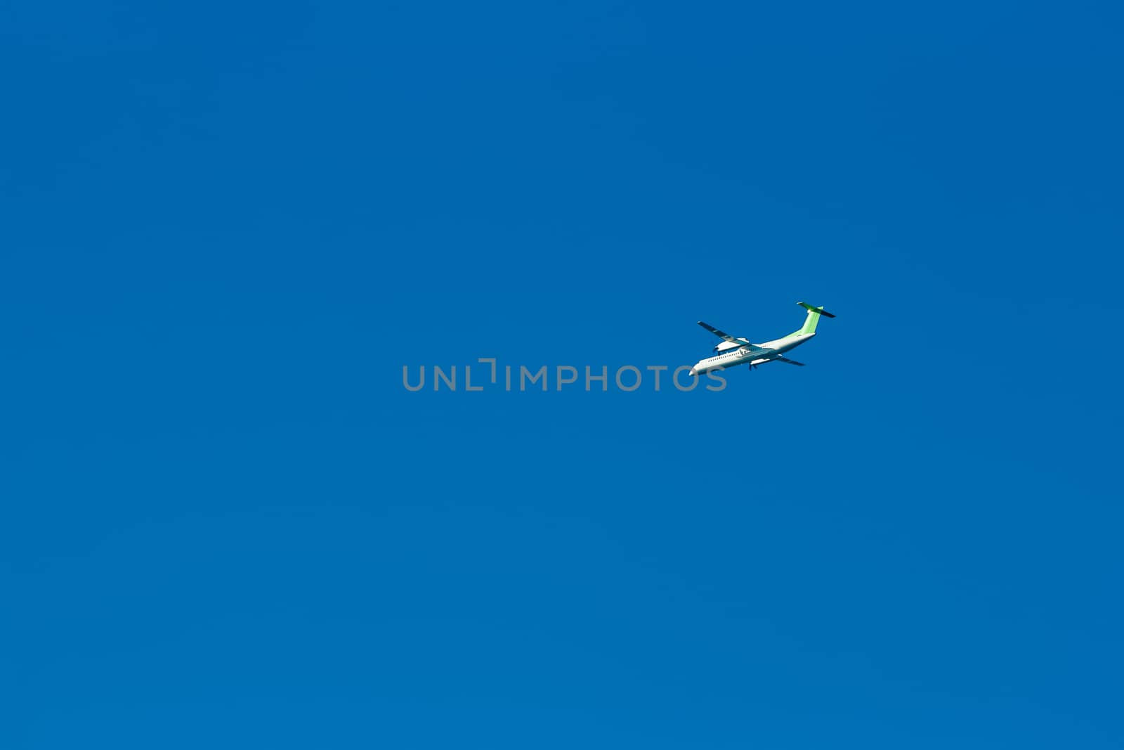 Passenger aircraft flying in the blue sky