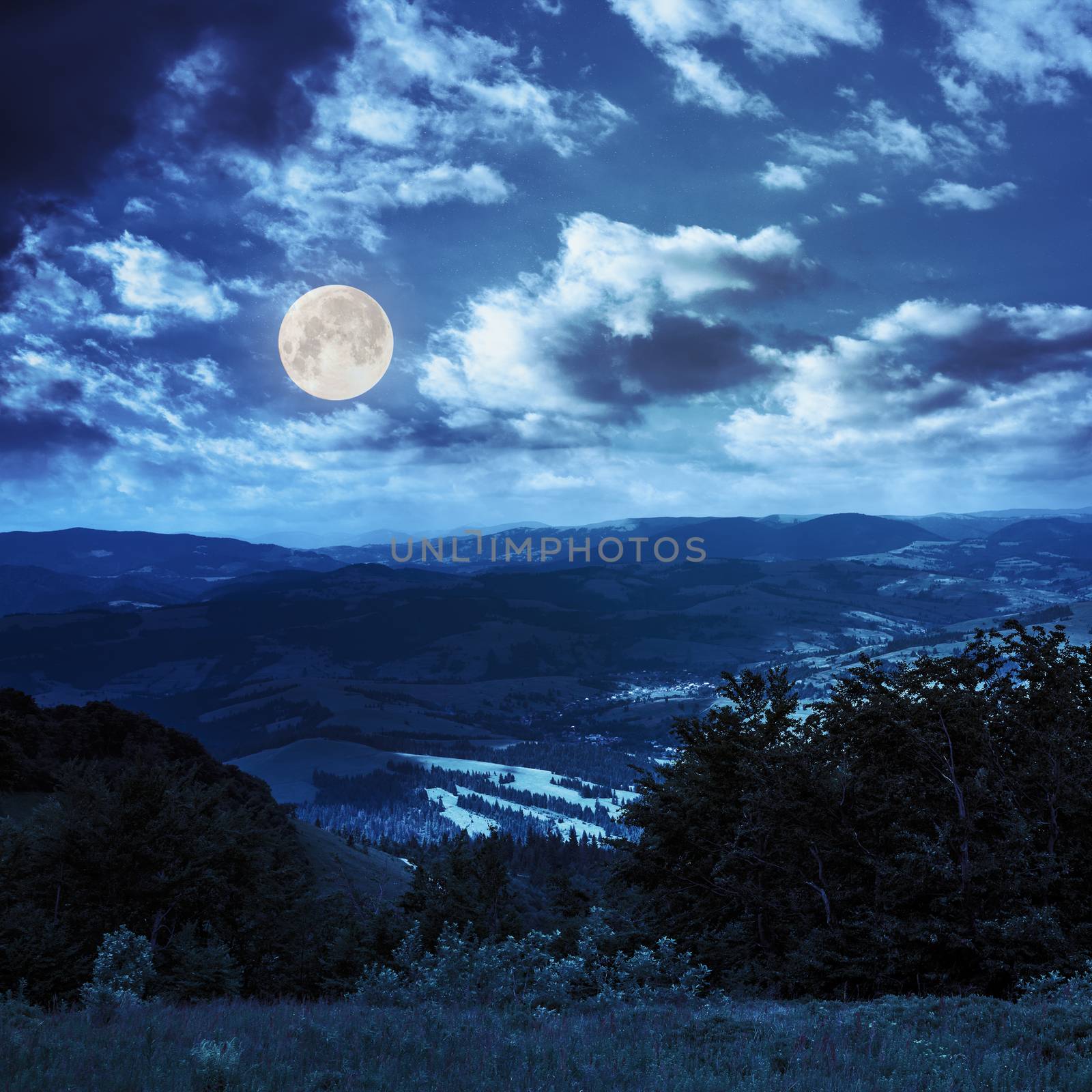 village in mountain valley at night by Pellinni