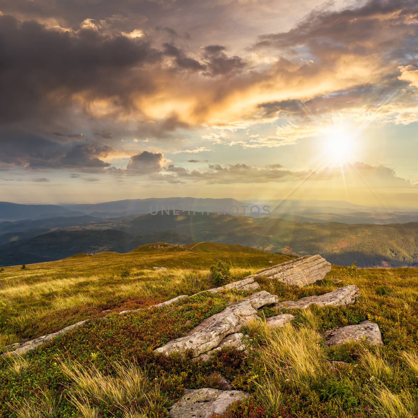 stones on the mountain top at sunset by Pellinni